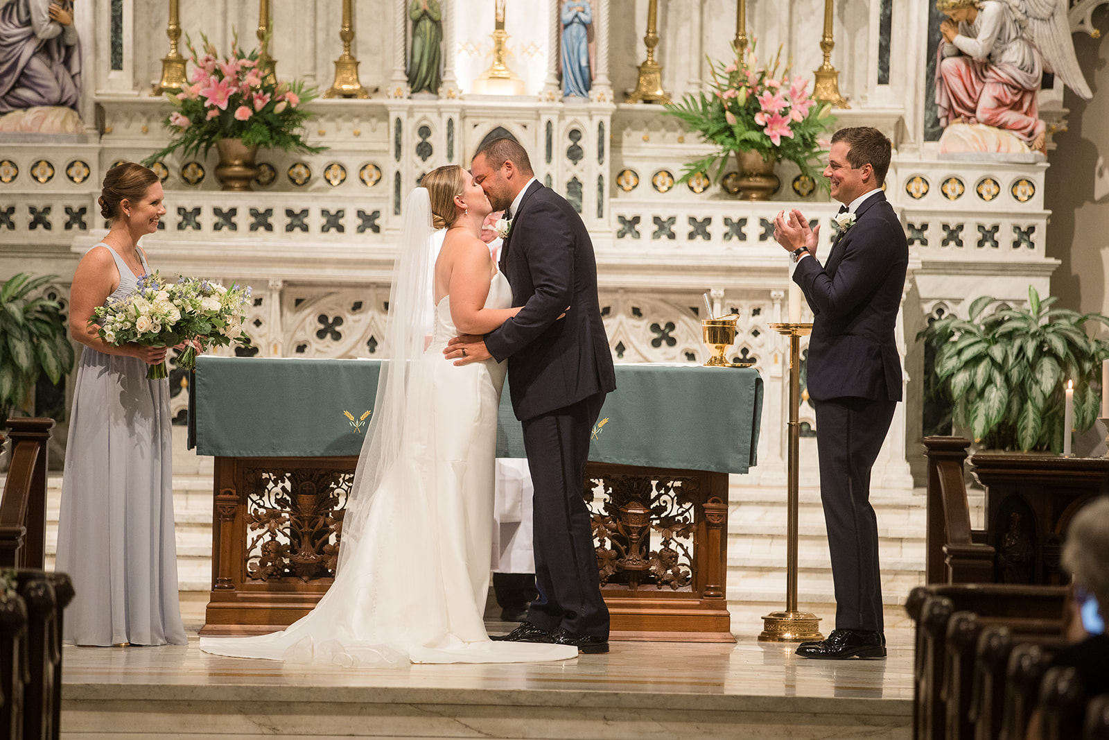 bride and groom first kiss at St. Mary's church in Annapolis