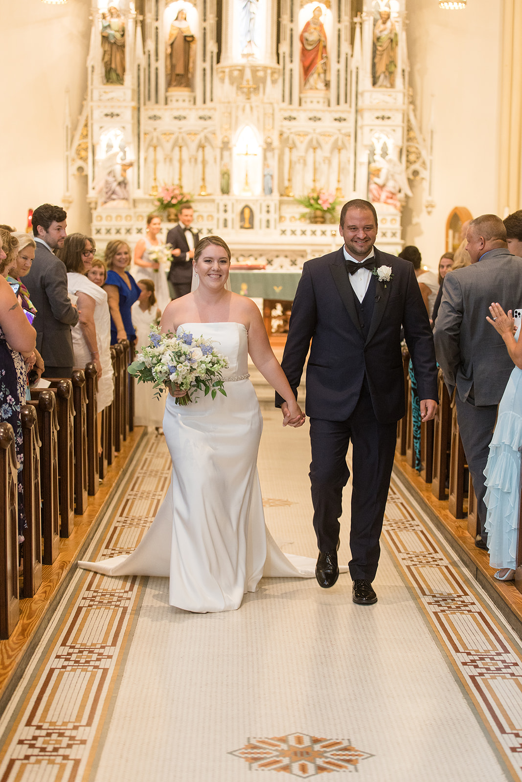 bride and groom walk back down the aisle