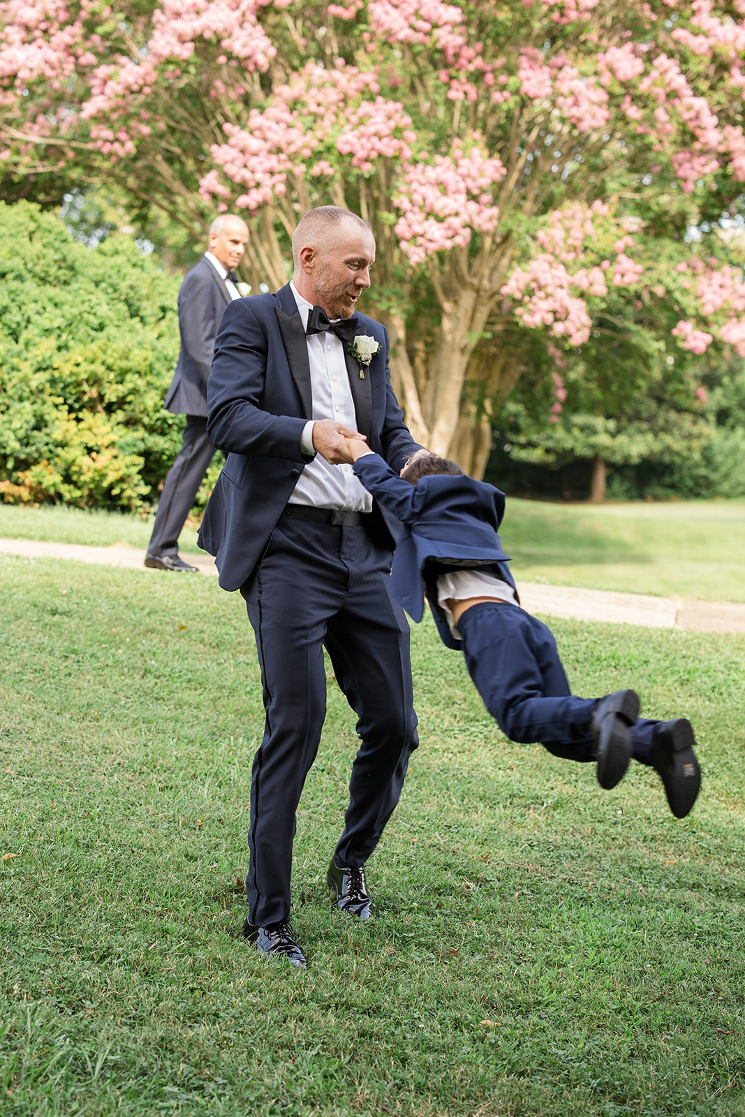 family member swinging a kid by the arms