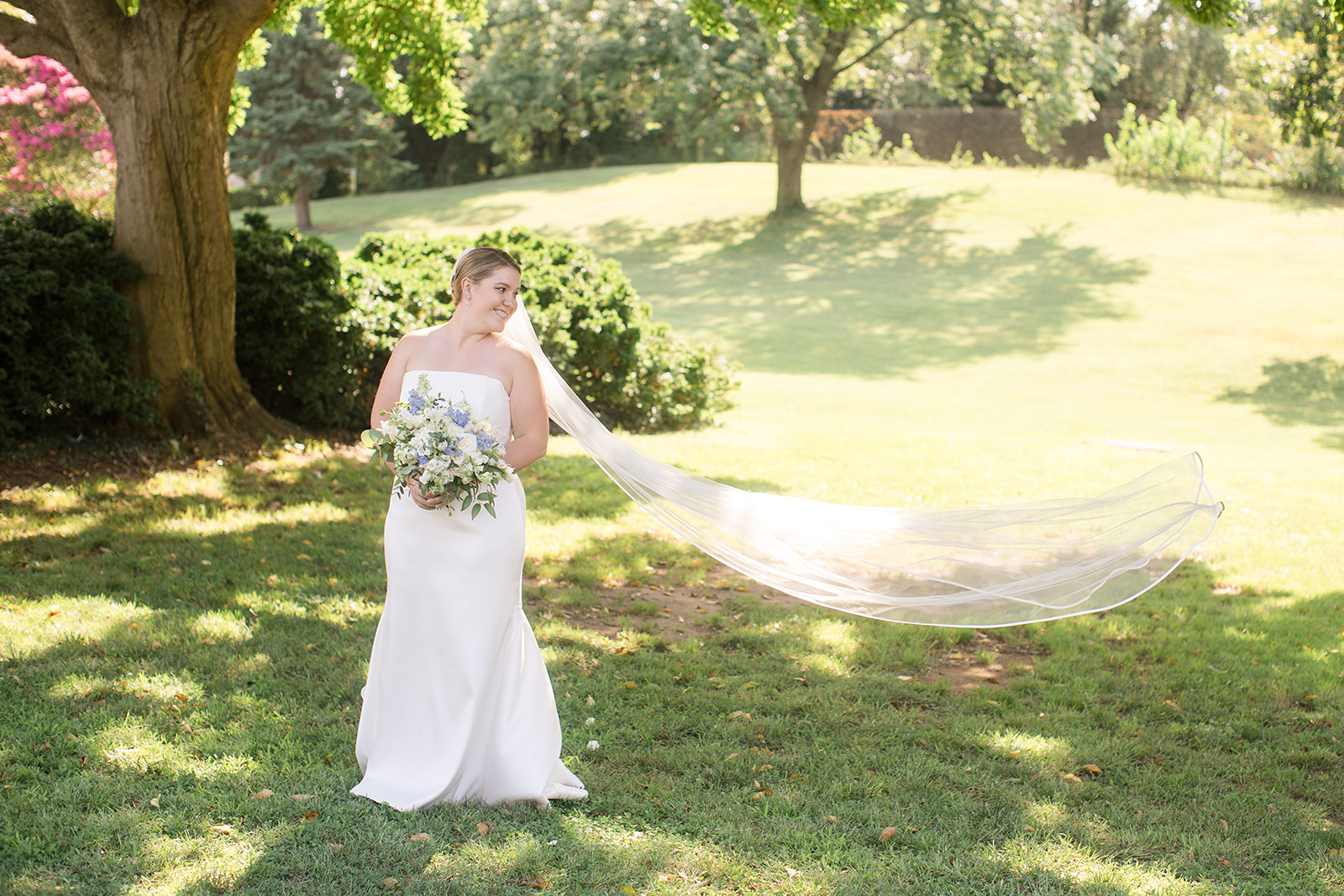 bride portrait veil flowing in the wind