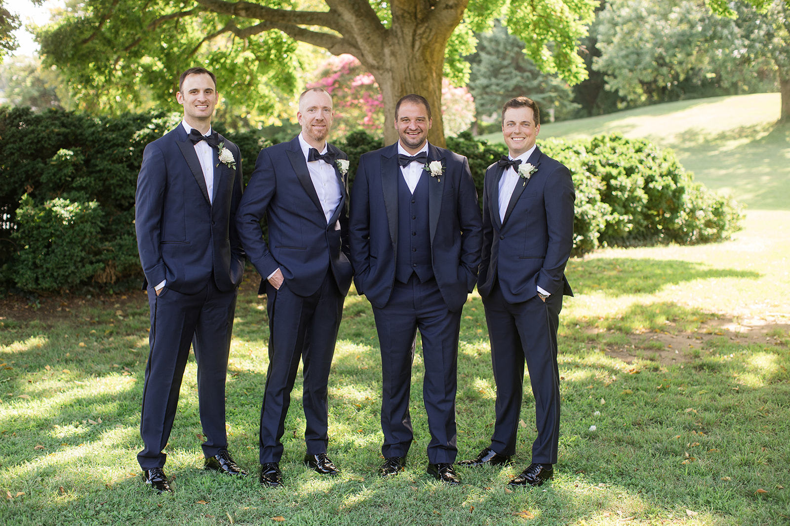 groom with groomsmen in garden