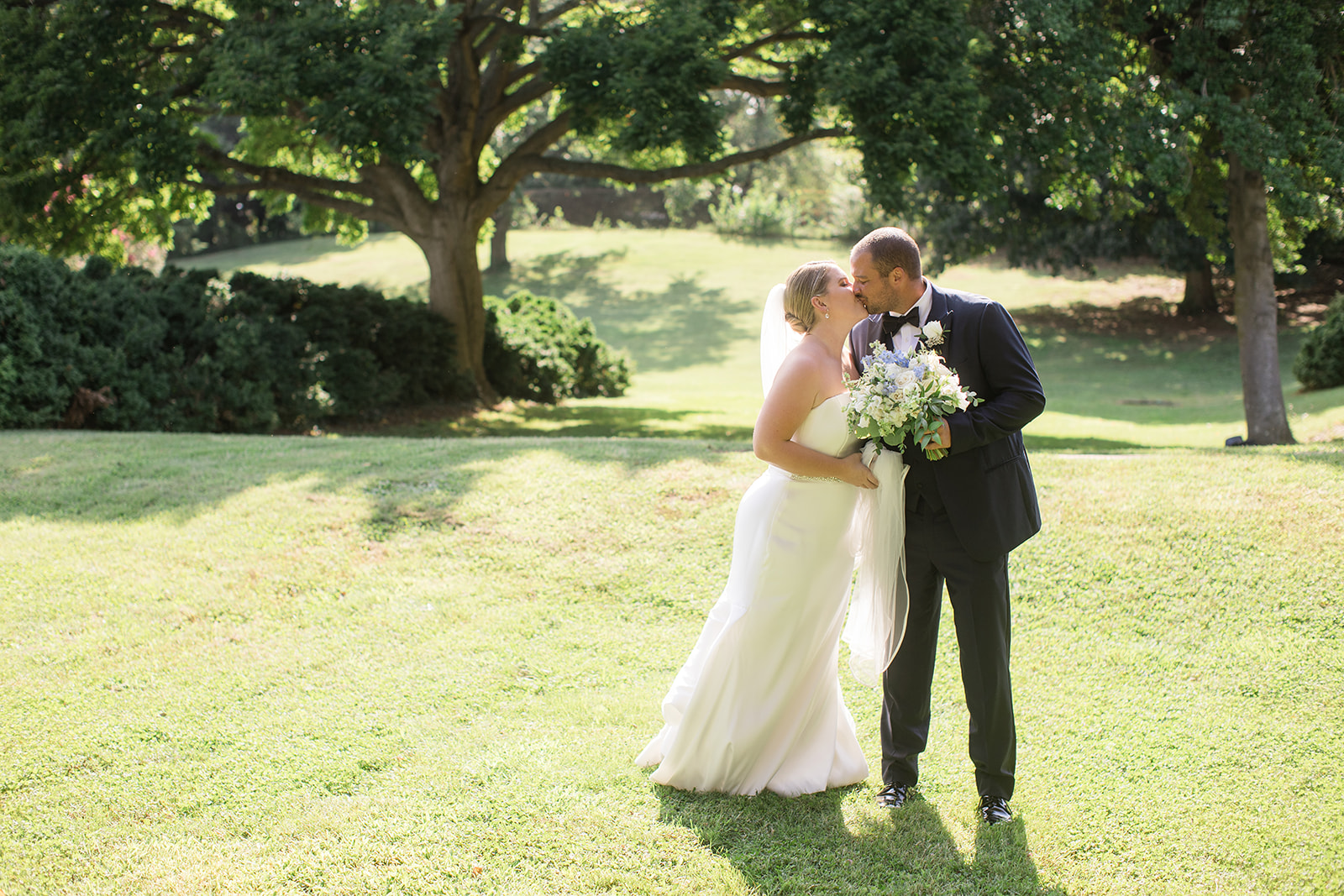 bride and groom portrait in grass