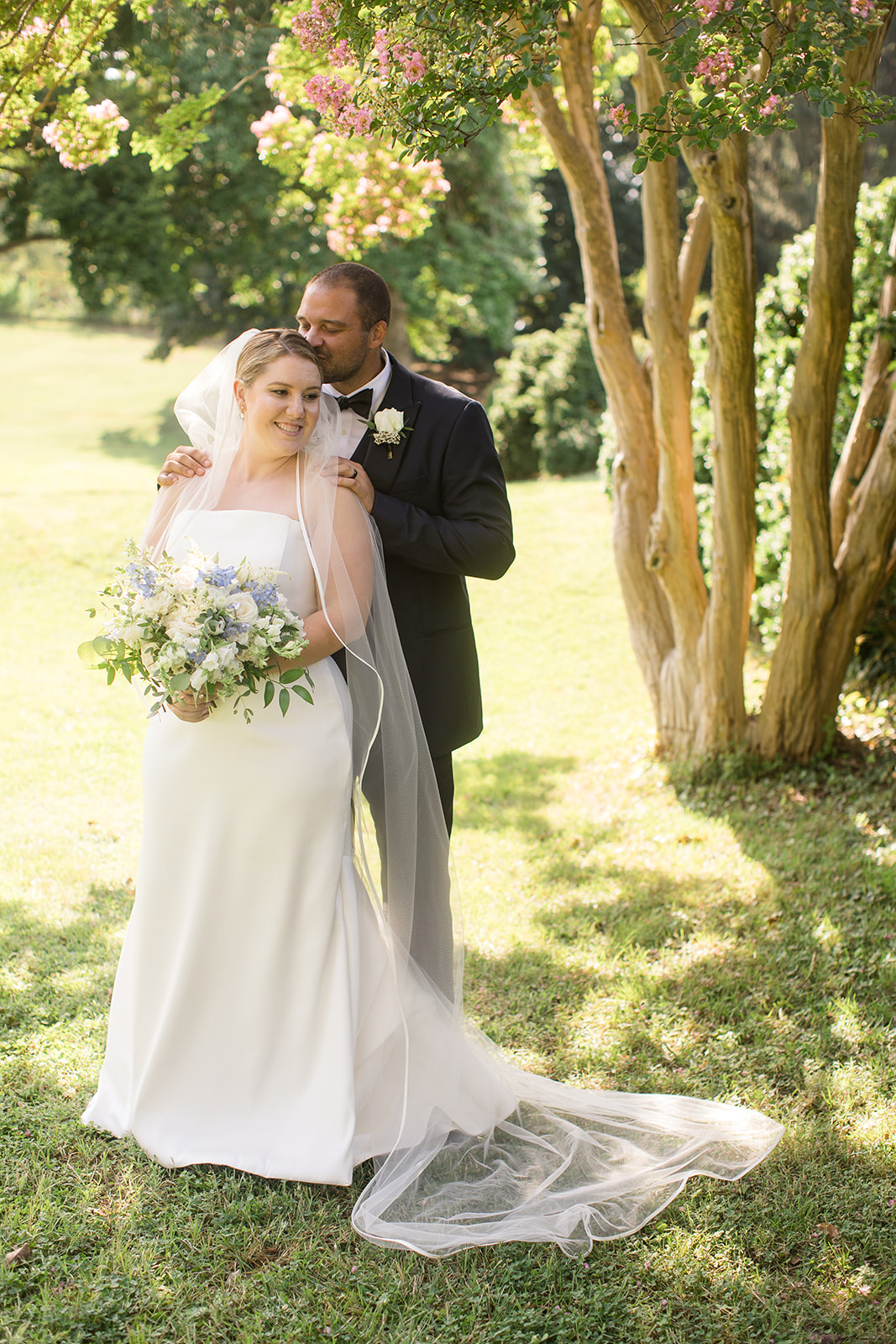 bride and groom portrait in grass