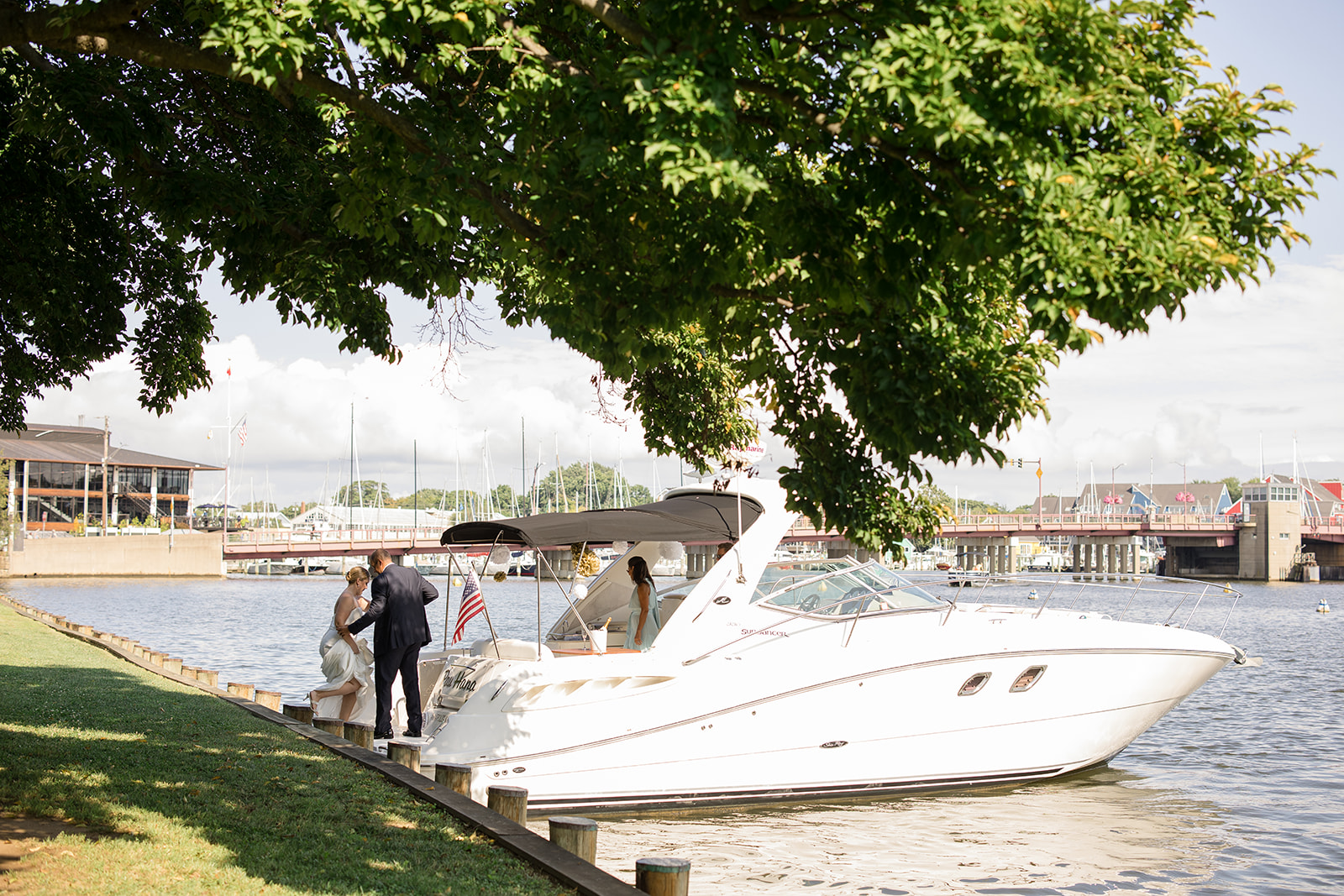 bride and groom getting on boat