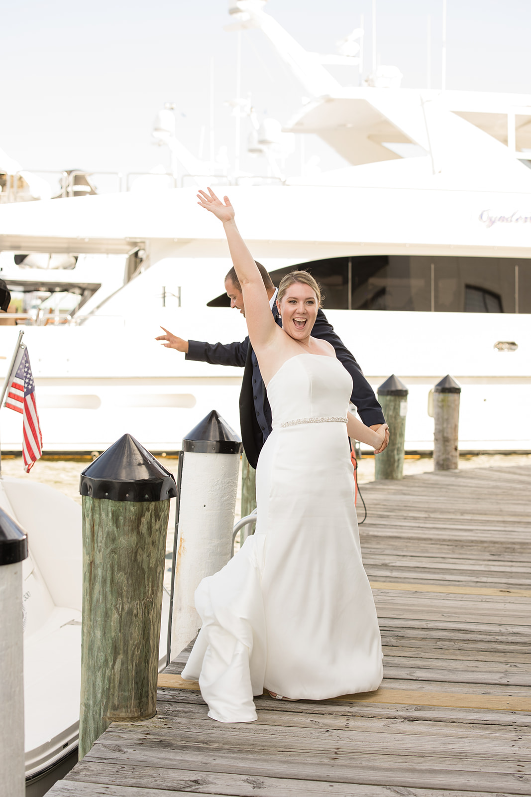 bride excited cheering on dock