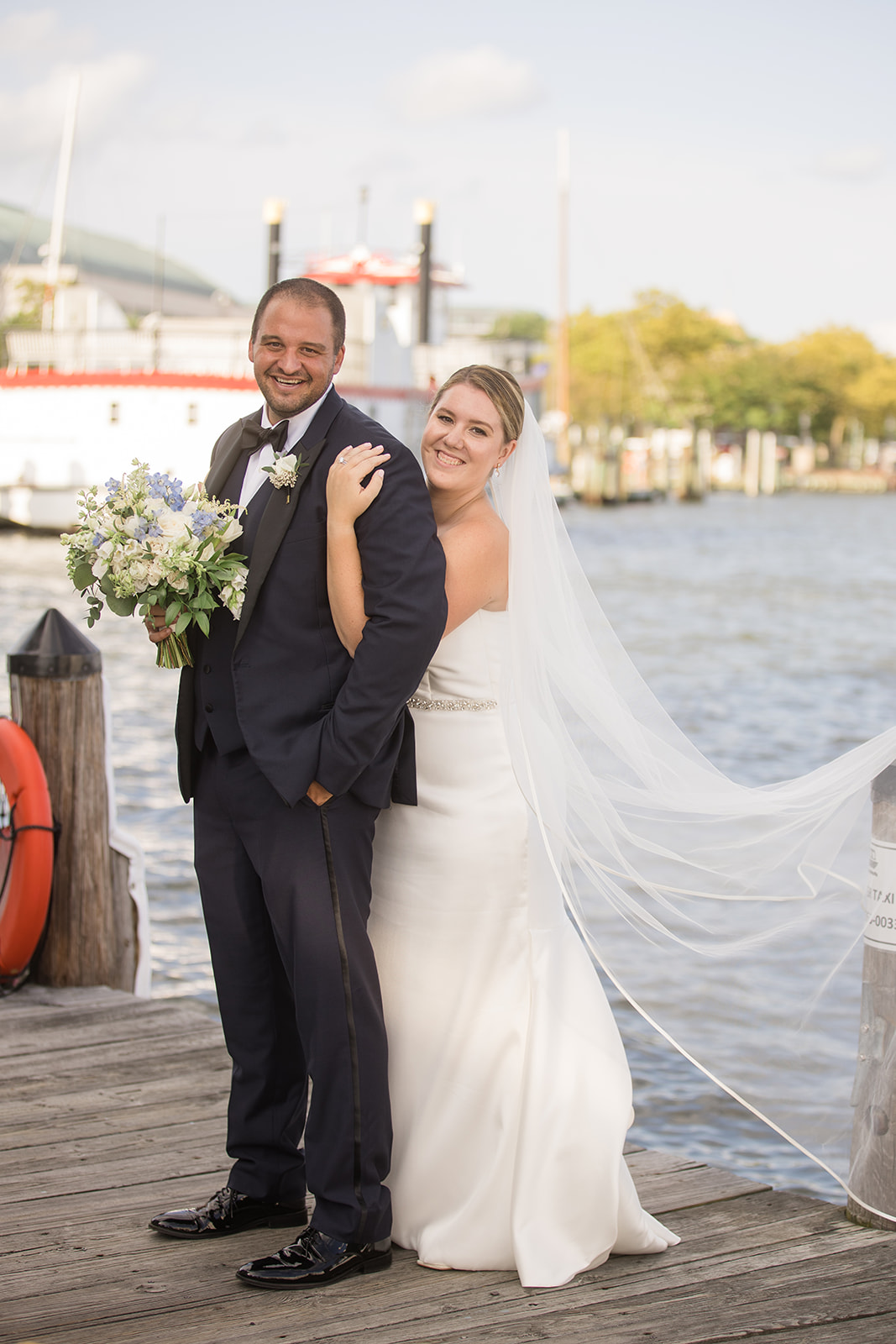 bride and groom portrait on annapolis docks