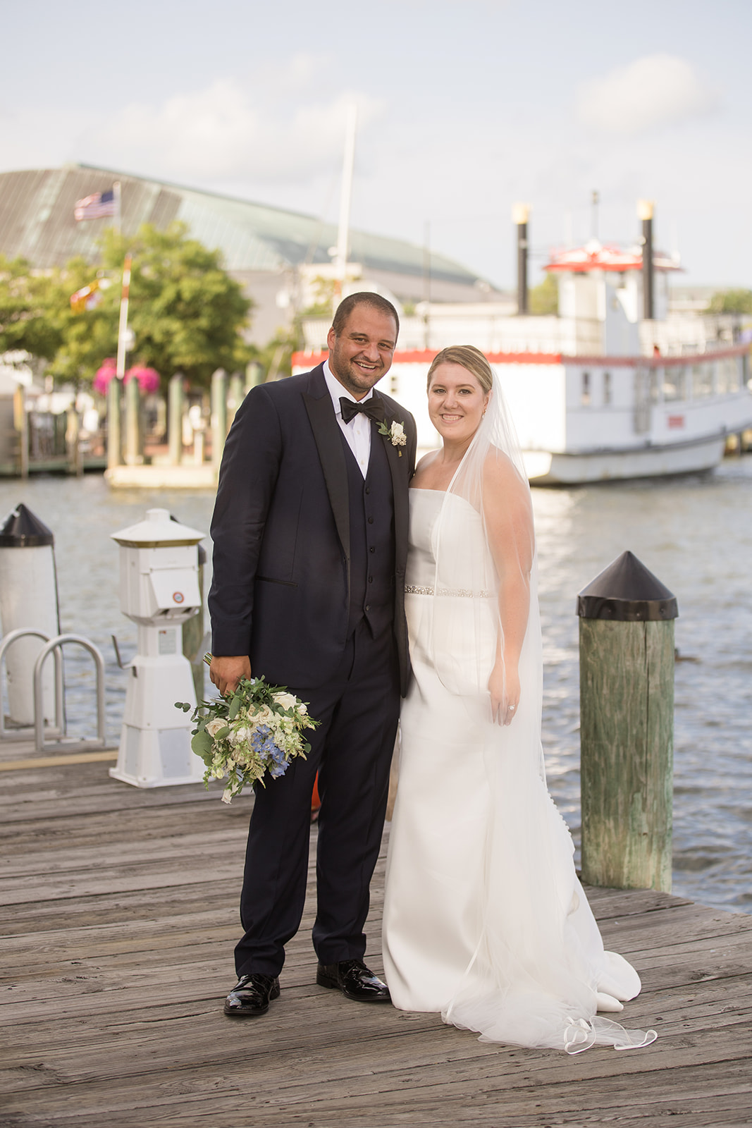 bride and groom portrait on annapolis docks