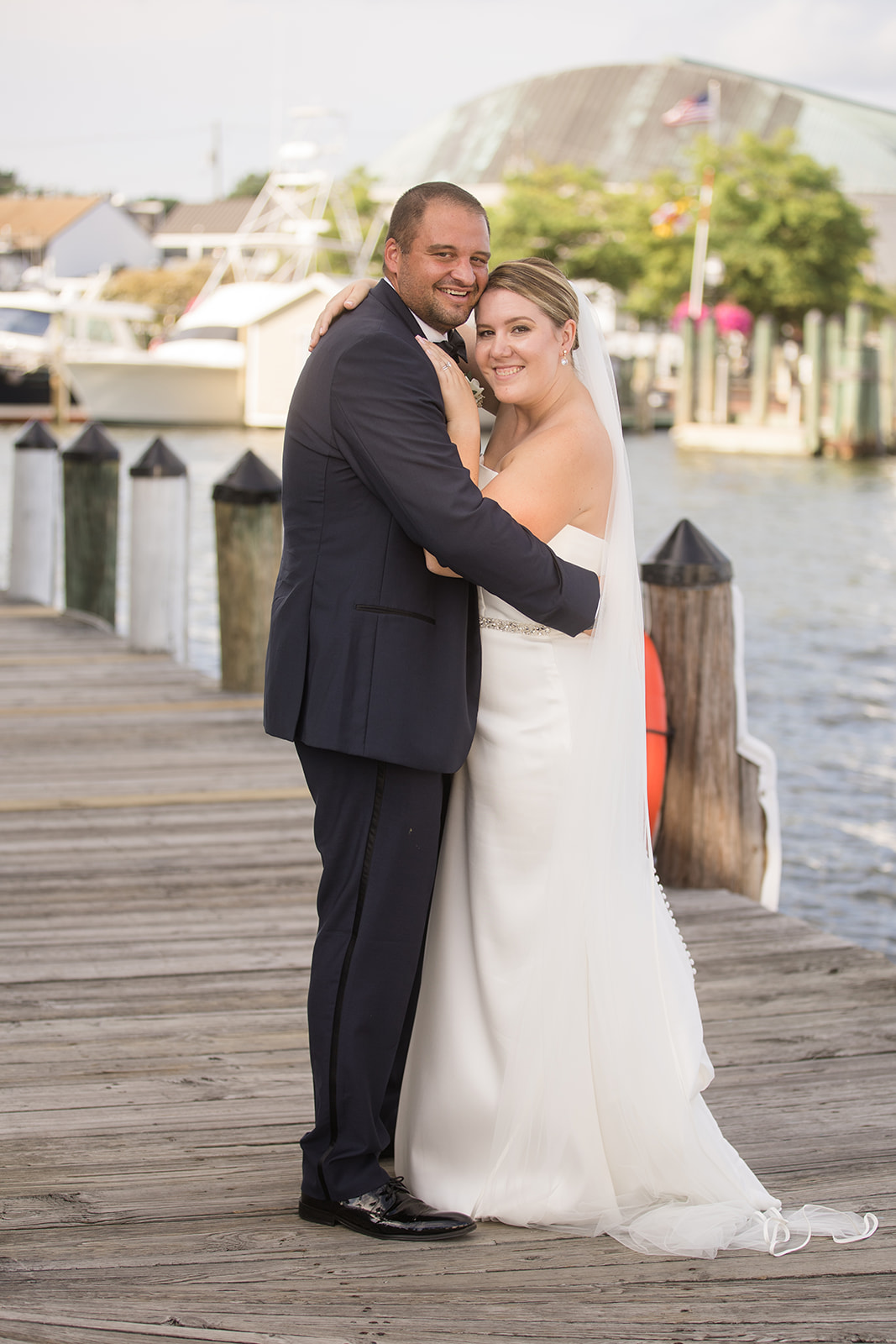 bride and groom portrait on annapolis docks