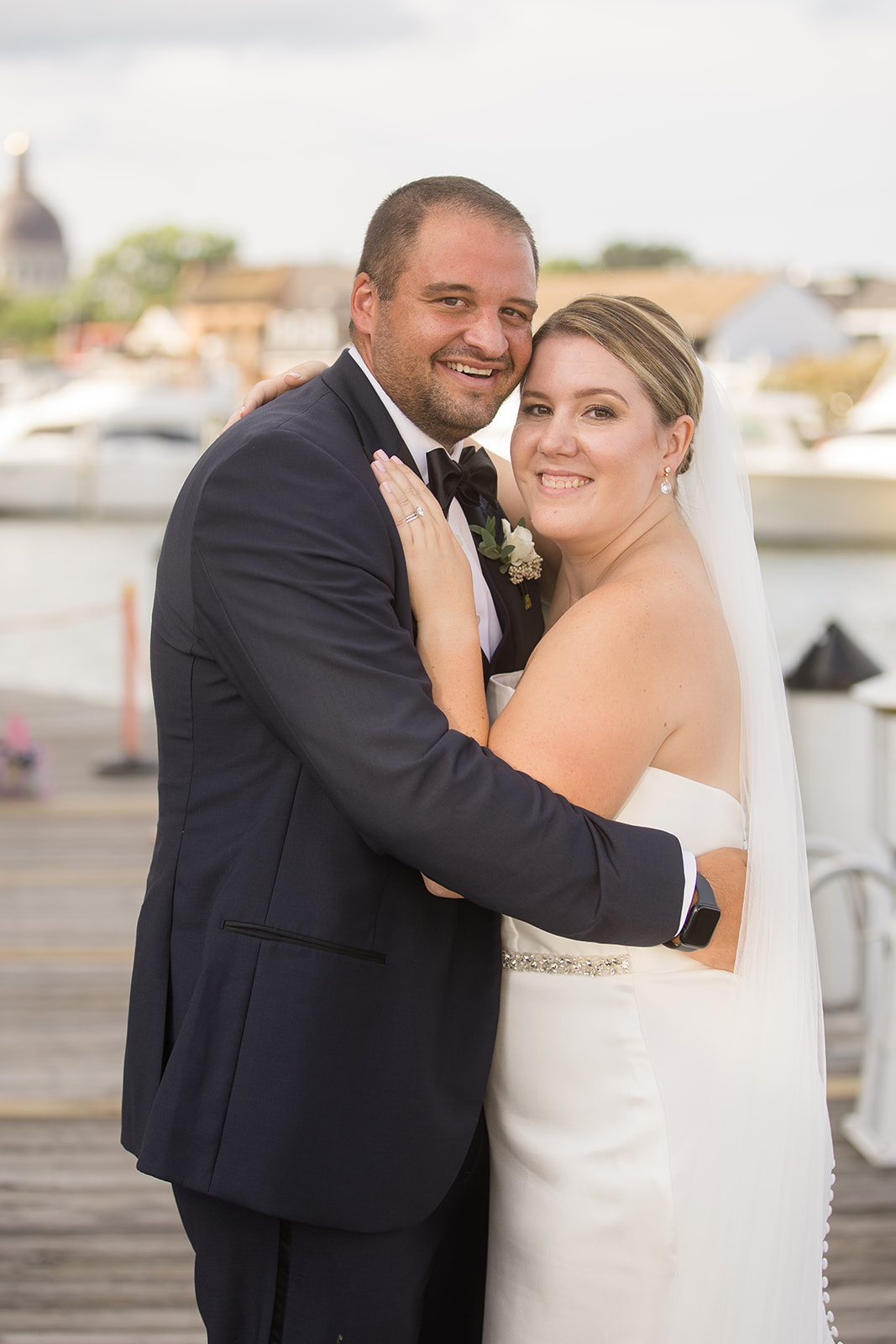 bride and groom portrait on annapolis docks