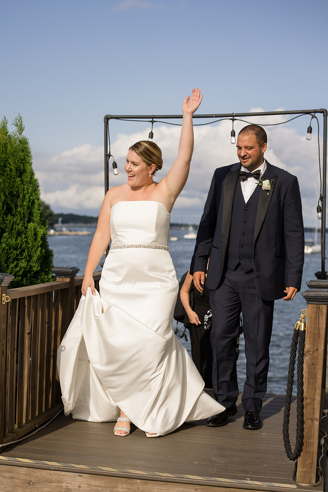 bride and groom cheer as they enter cocktail hour