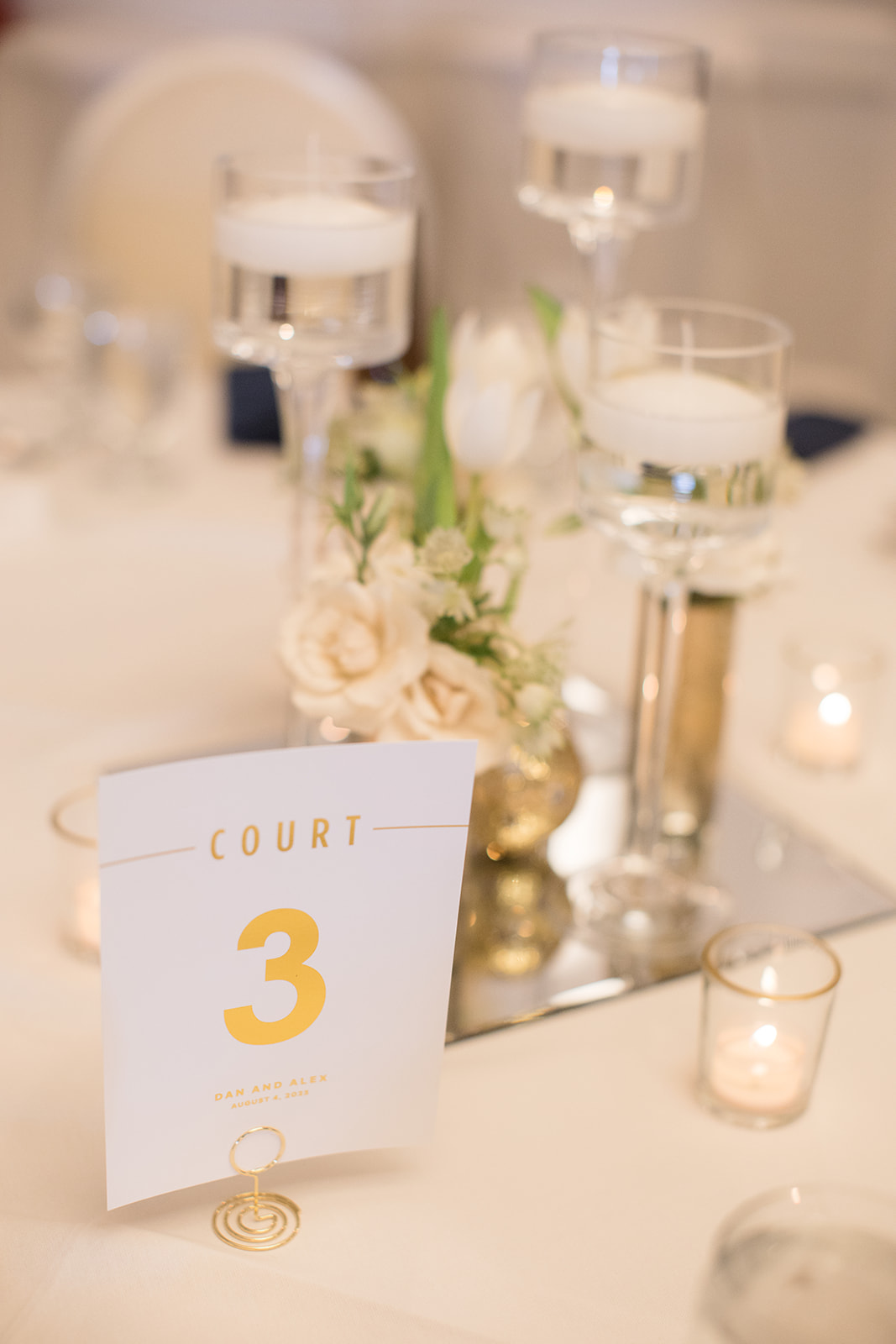 white and gold reception table number