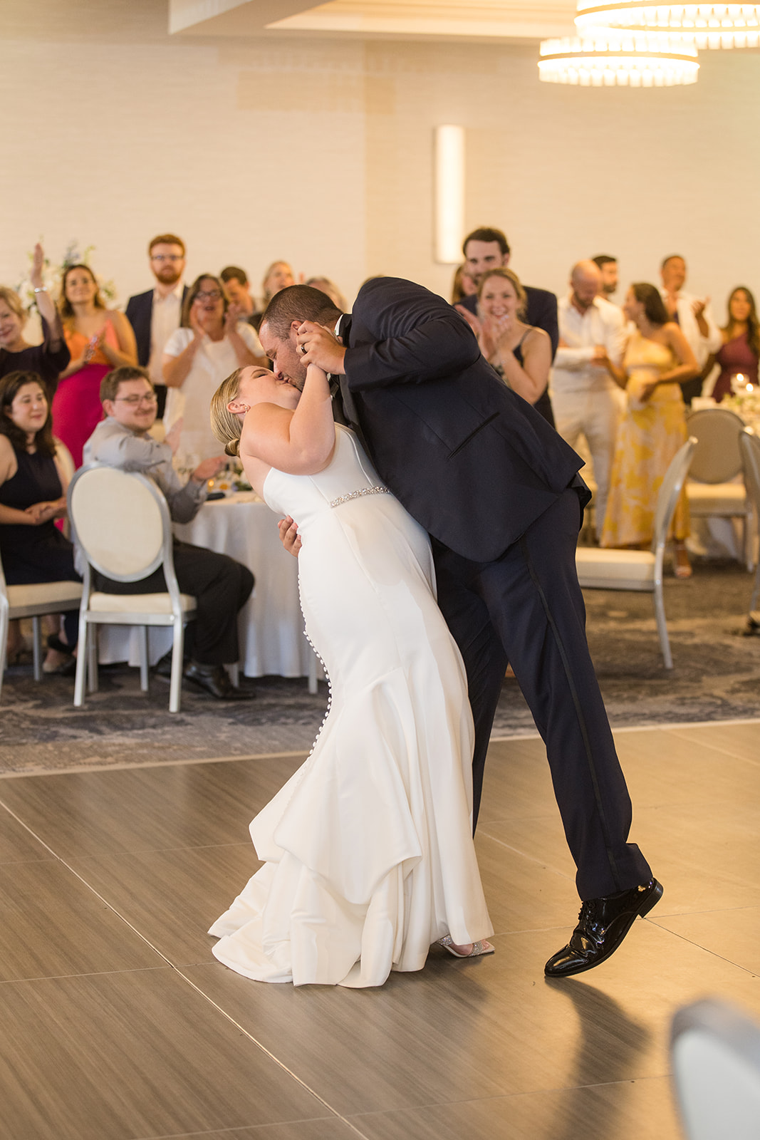 bride and groom first dance dip kiss