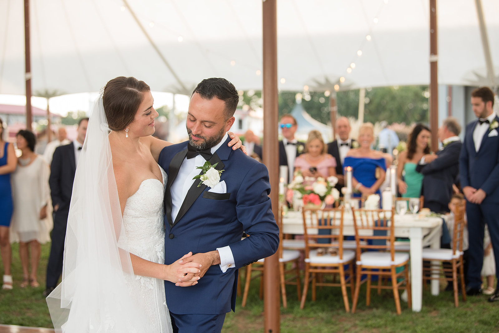 bride and groom first dance in tented reception