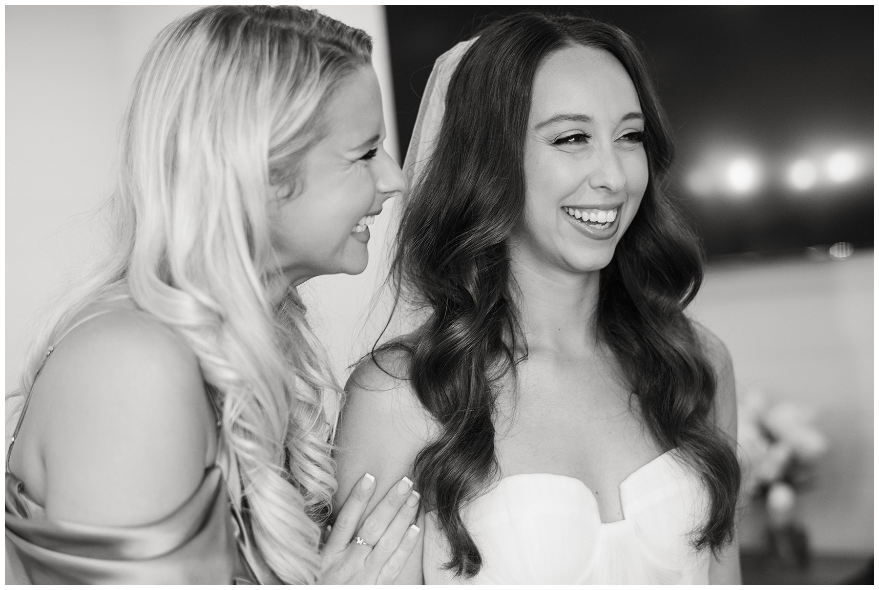 bride and sister laugh