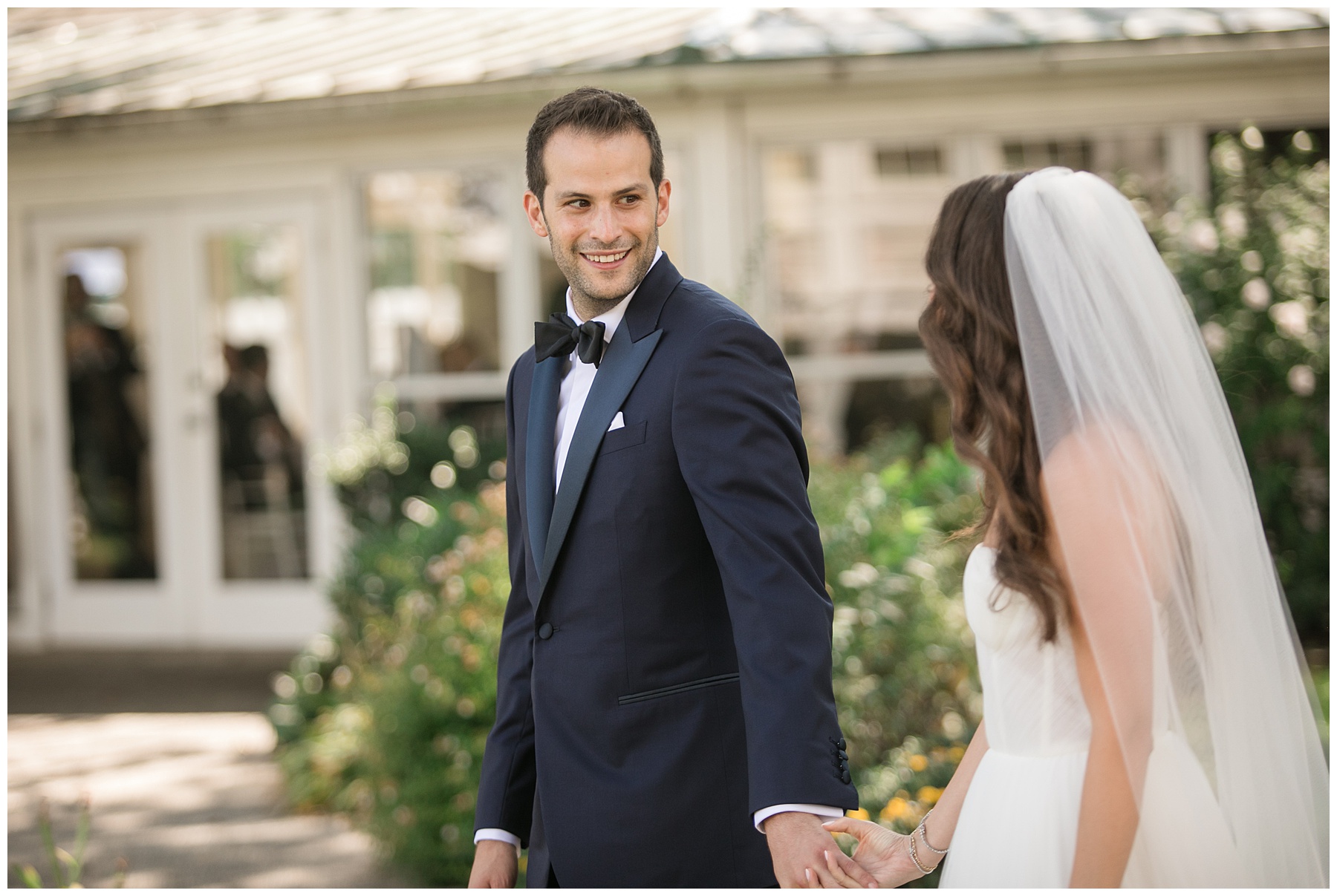 bride approaches for first look with groom