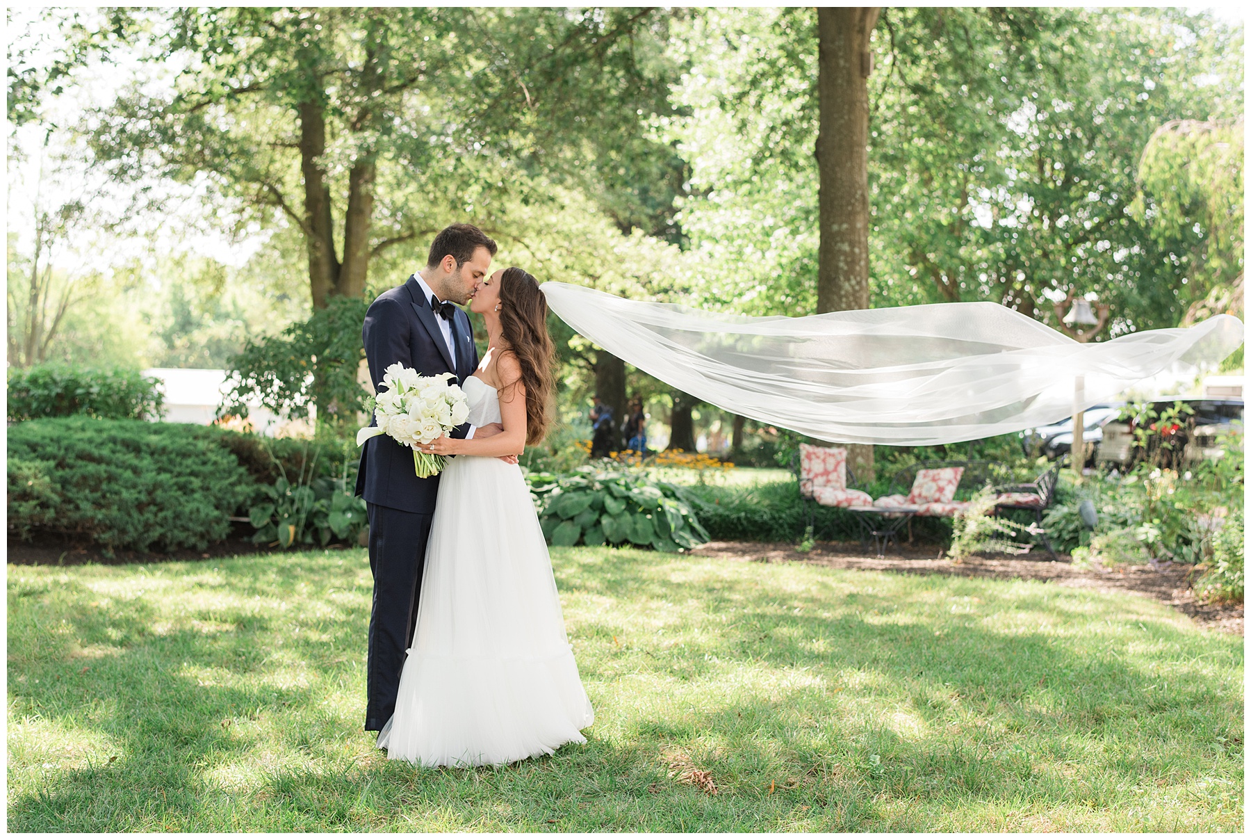 bride and groom portrait veil toss