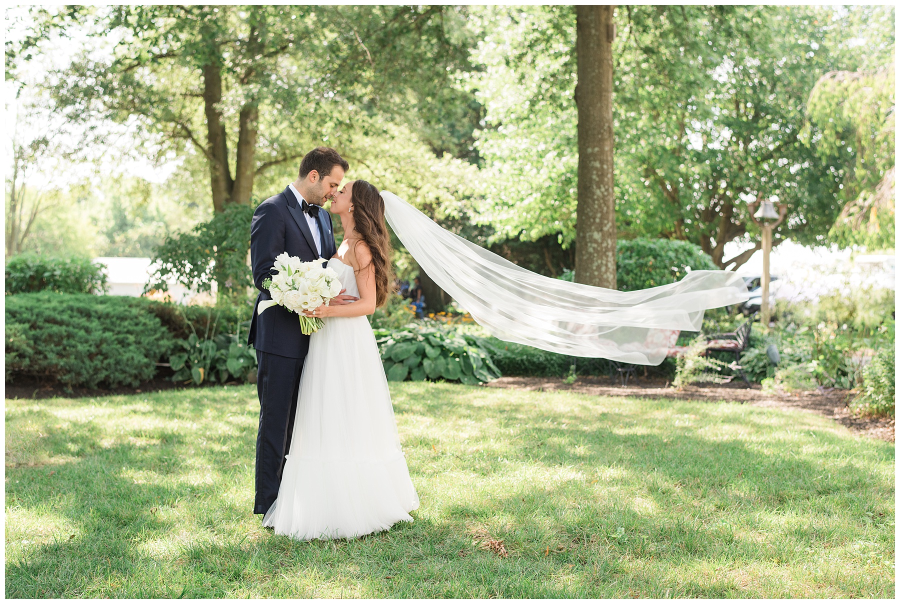 bride and groom portrait veil toss