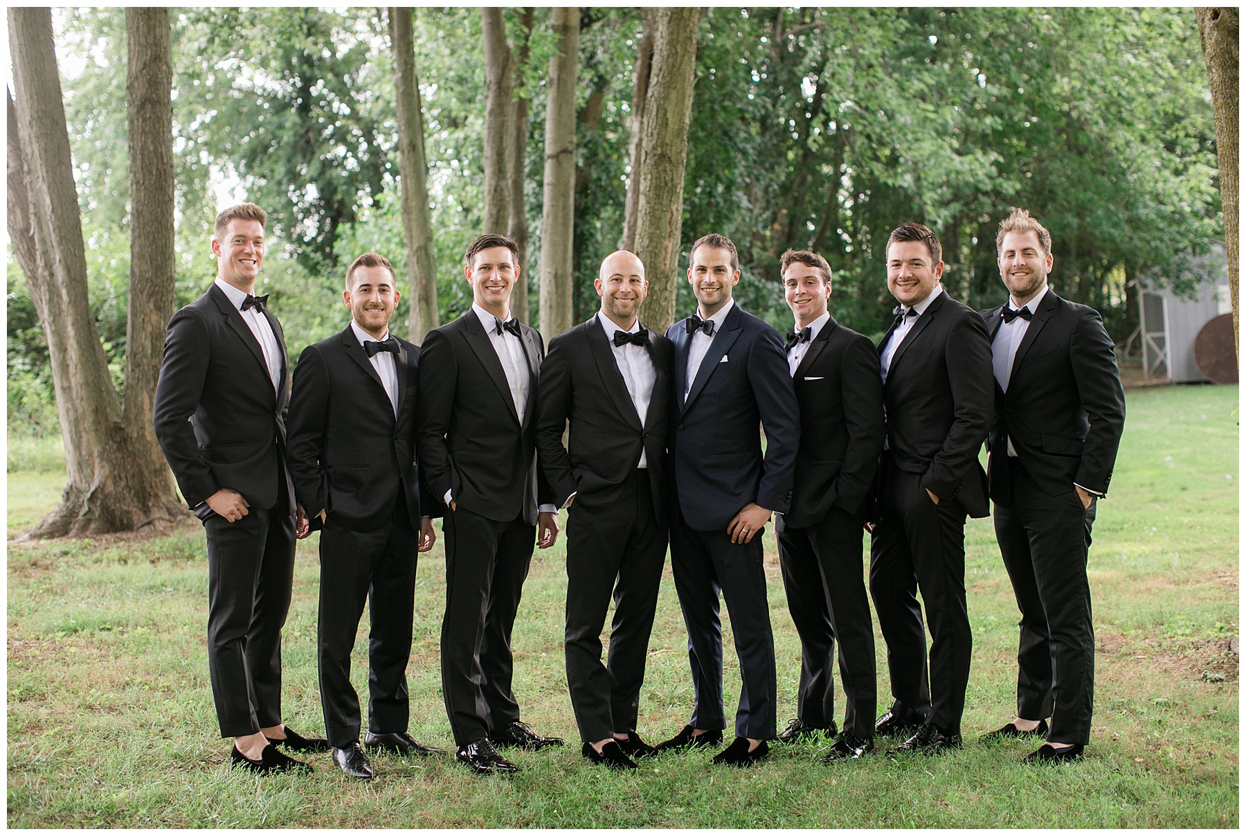 groom and groomsmen in tuxes