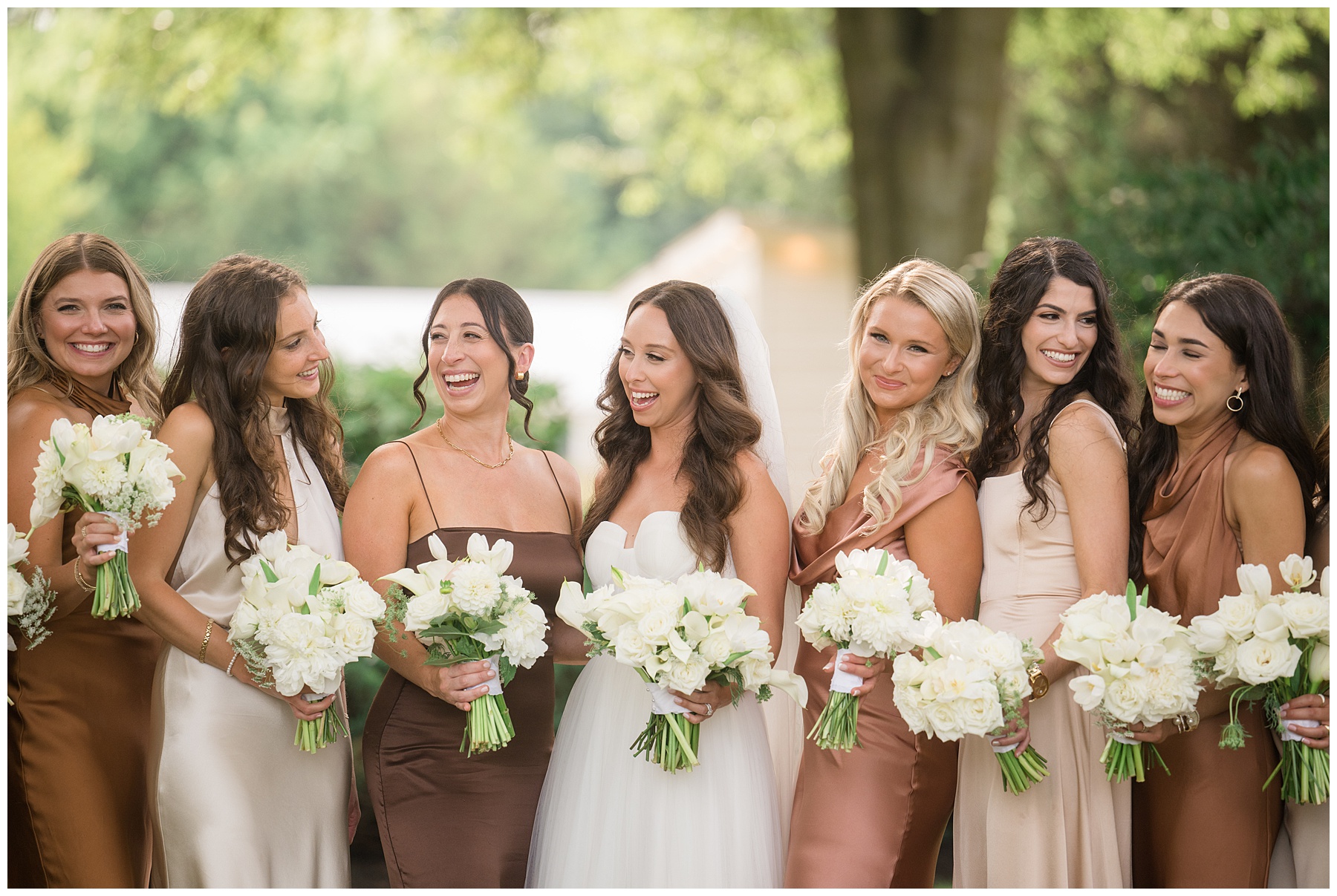 bride and bridesmaids laughing