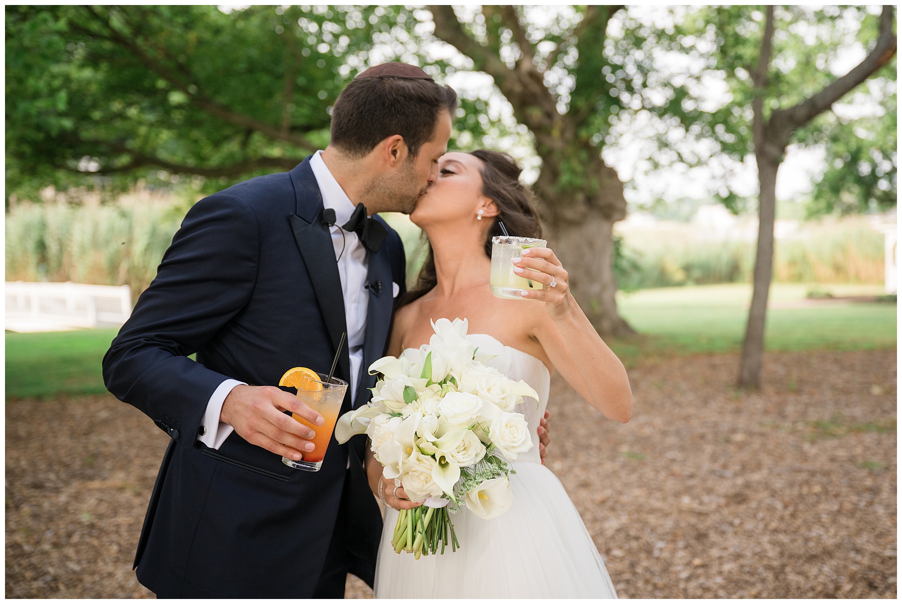 bride and groom kiss after getting married