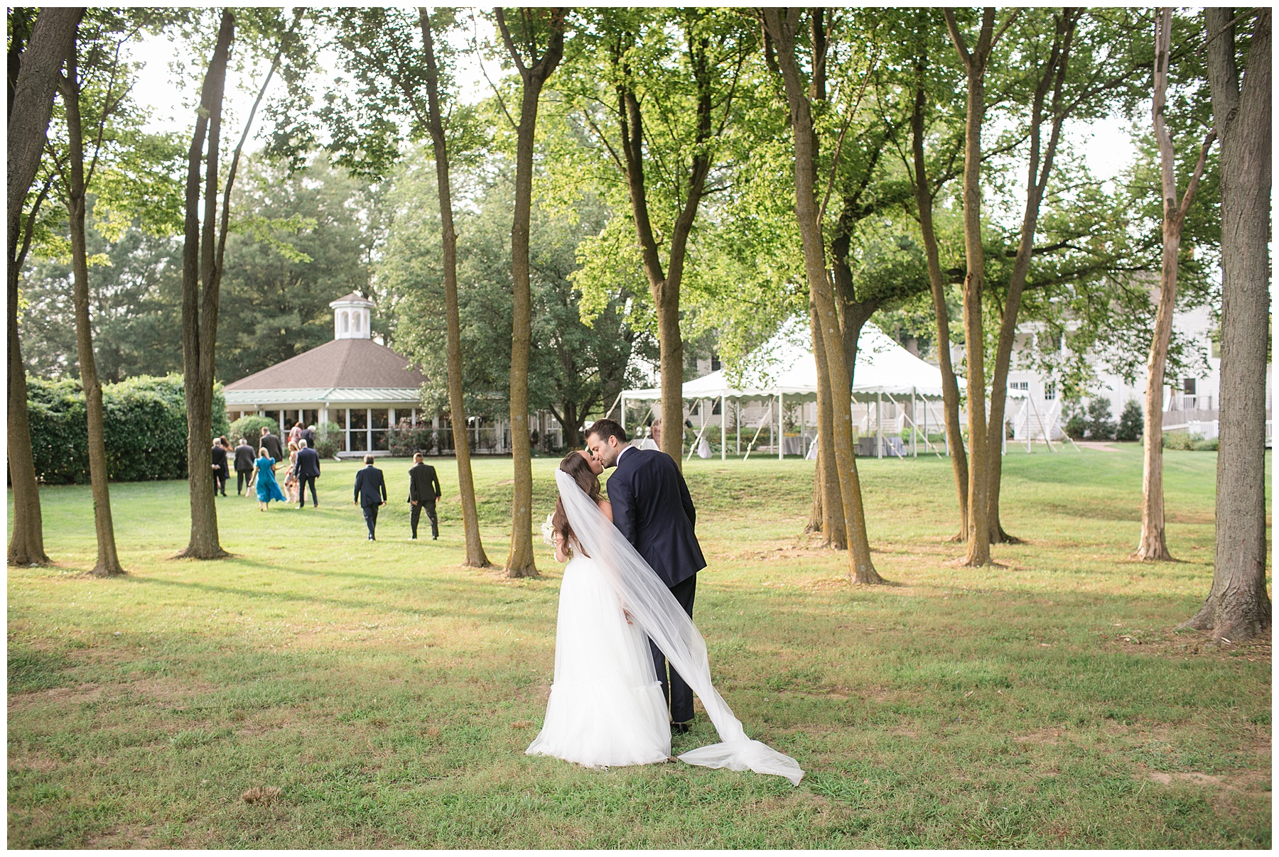 bride and groom kiss from afar