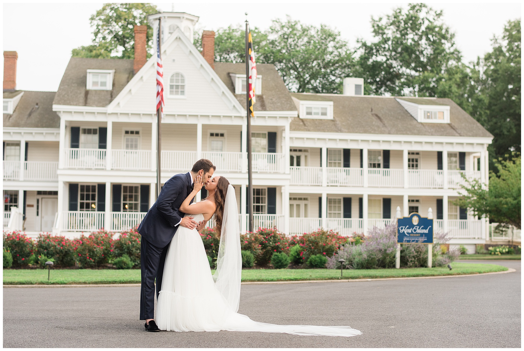 bride and groom kiss in front of kent island resort