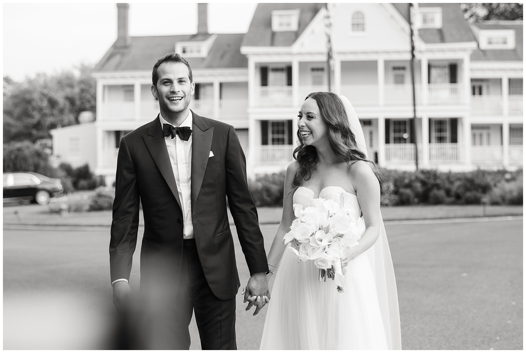 bride and groom in front of kent island resort