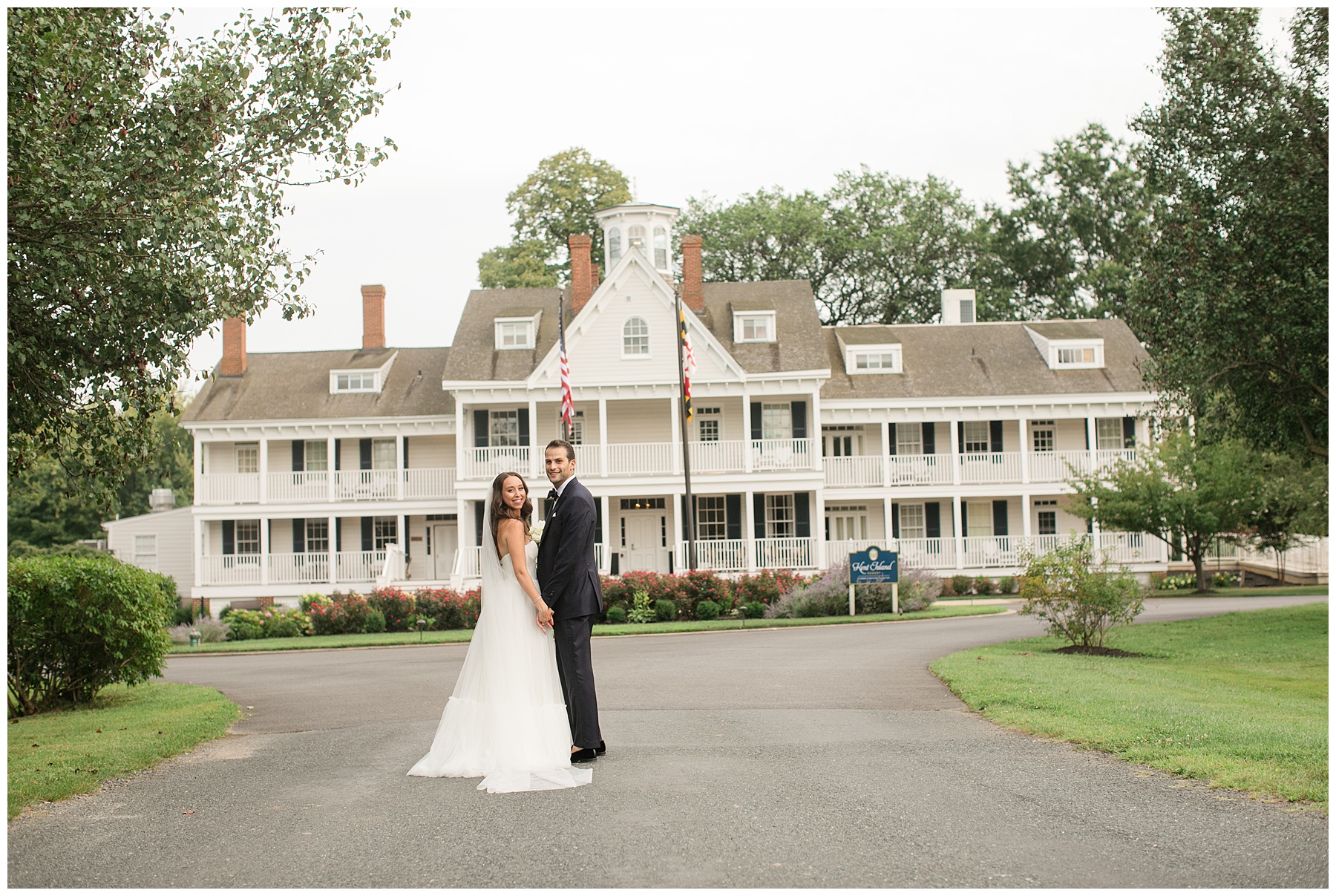 bride and groom in front of kent island resort