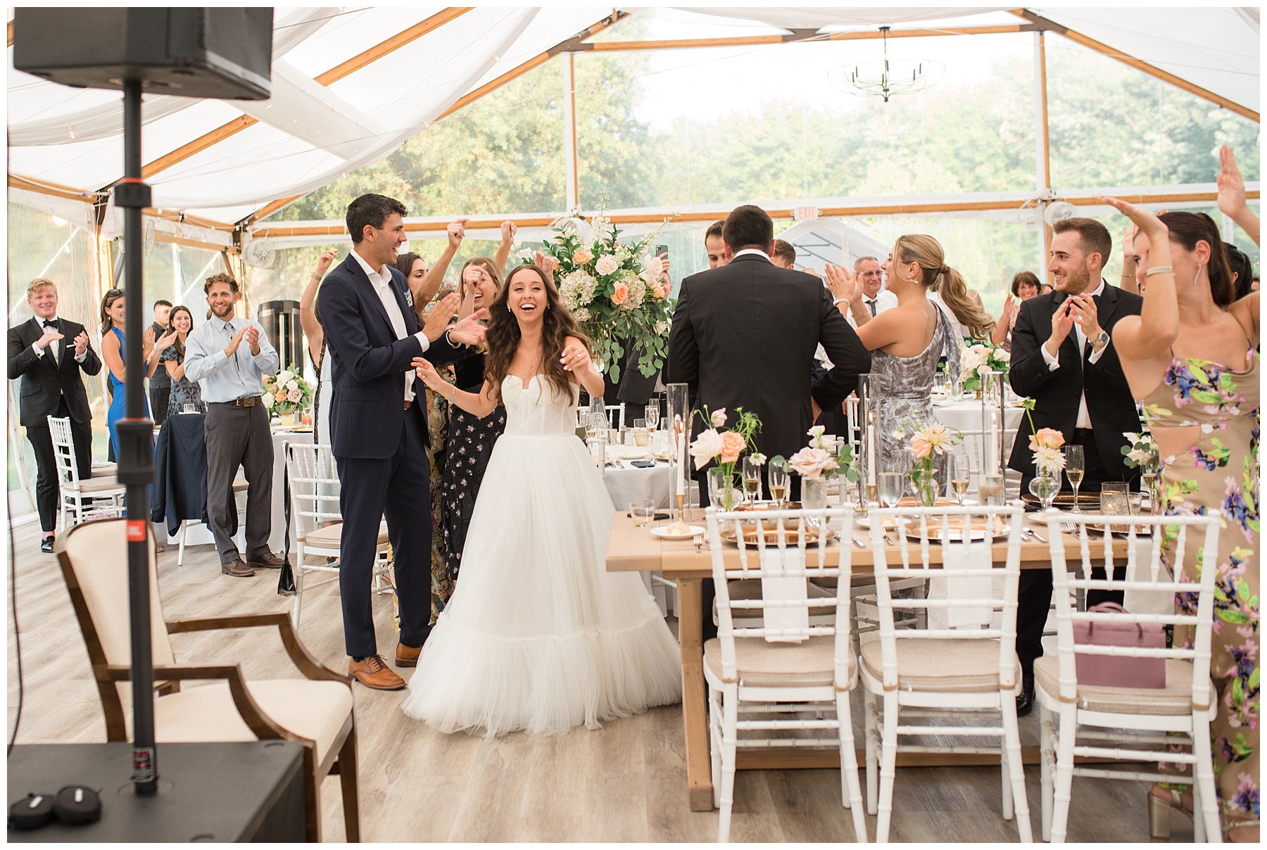 bride and groom entering reception