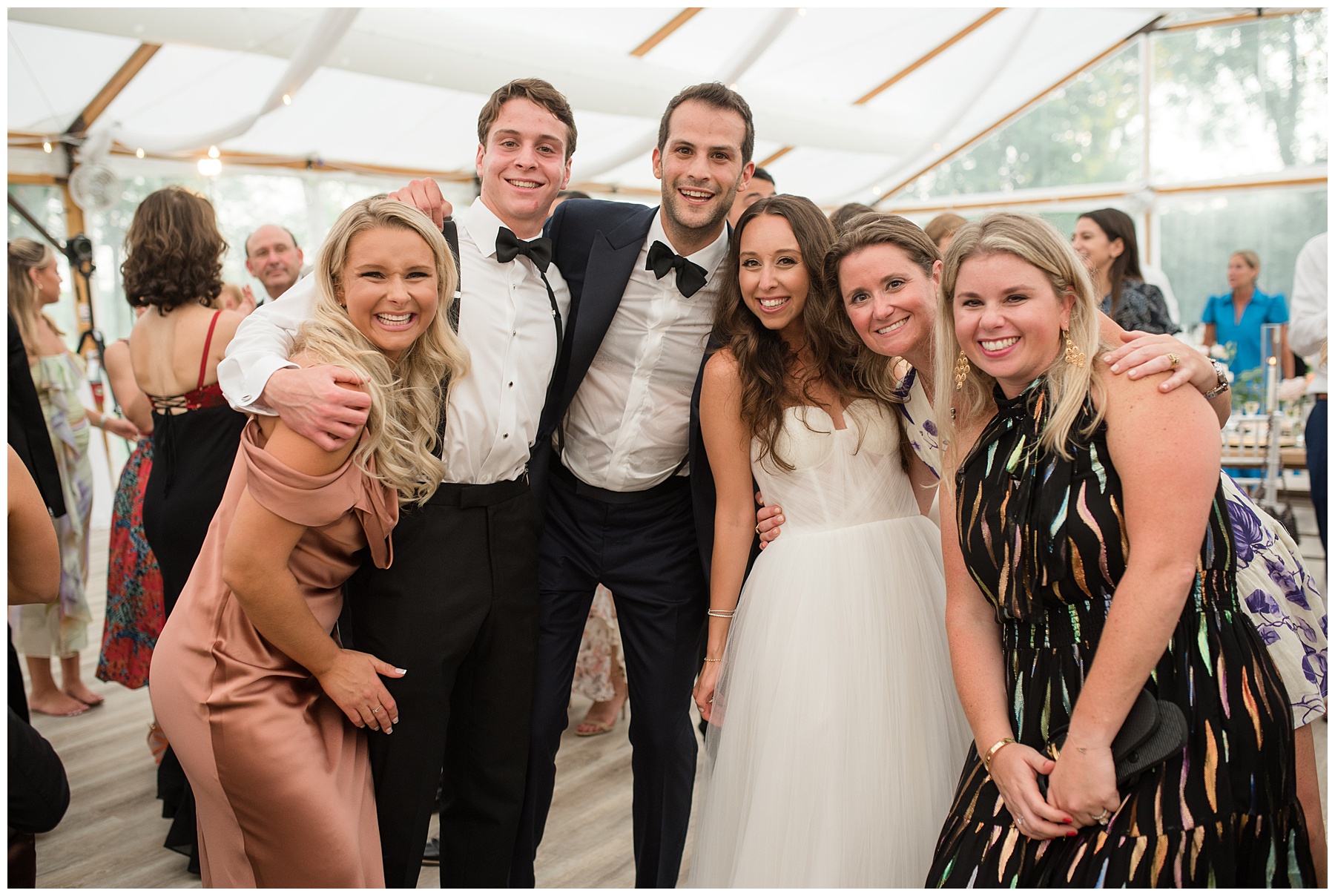 bride and groom and friends at wedding reception