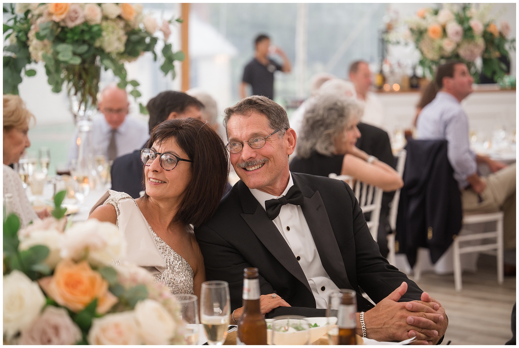 family members laugh during toasts