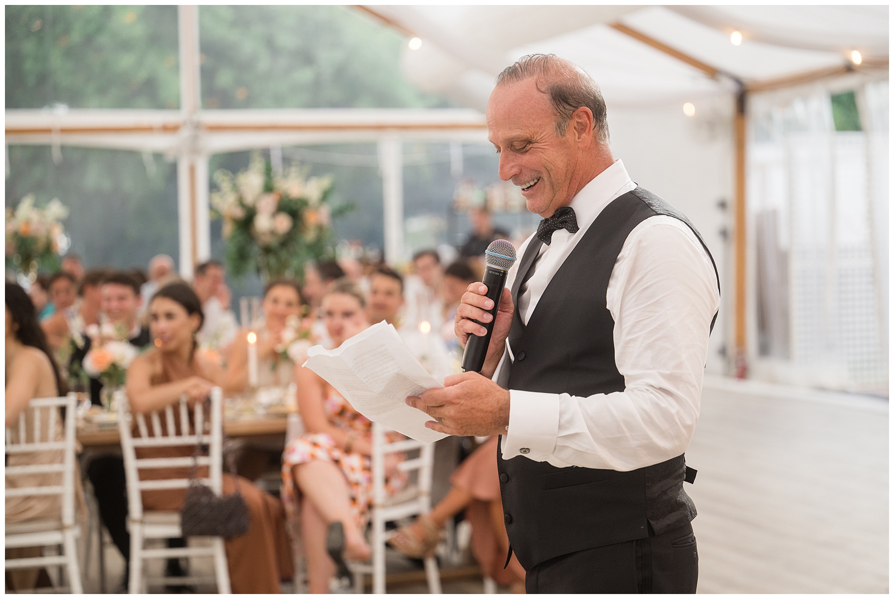 family member gives toast at wedding reception