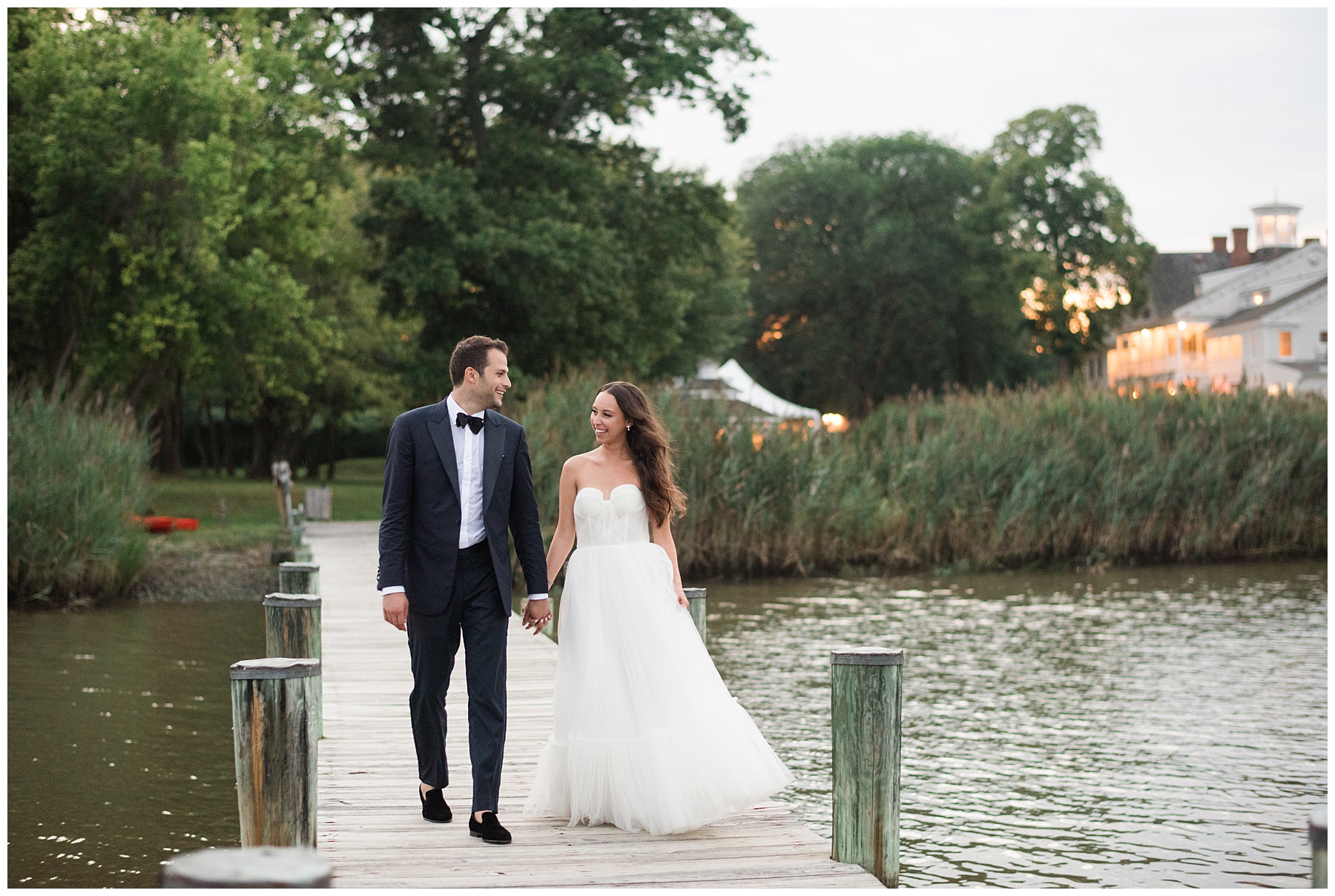 bride and groom walking on pier in kent island