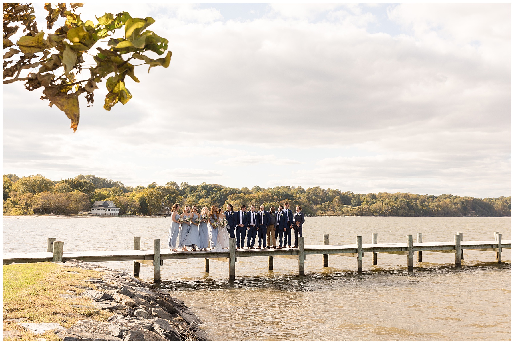 full wedding party on pier