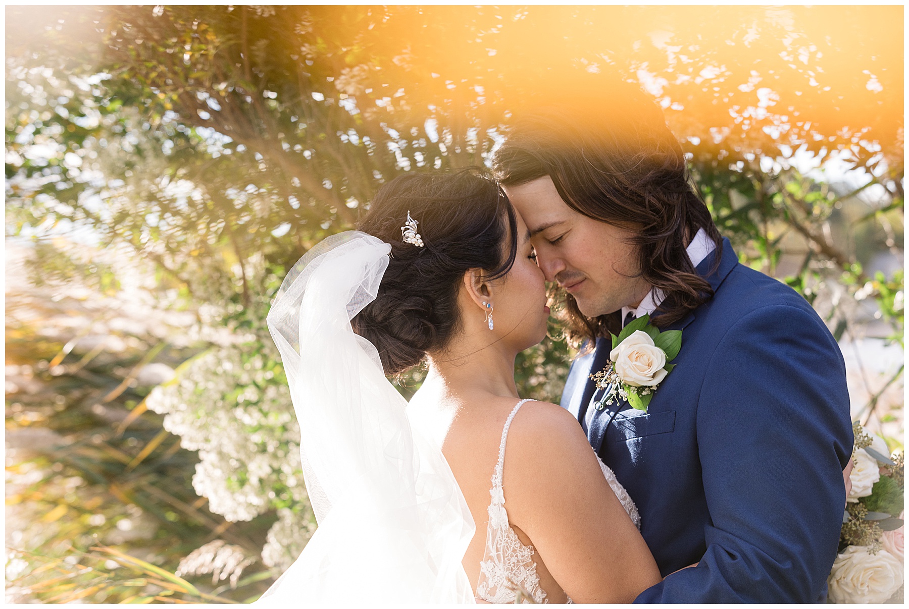 bride and groom touch foreheads