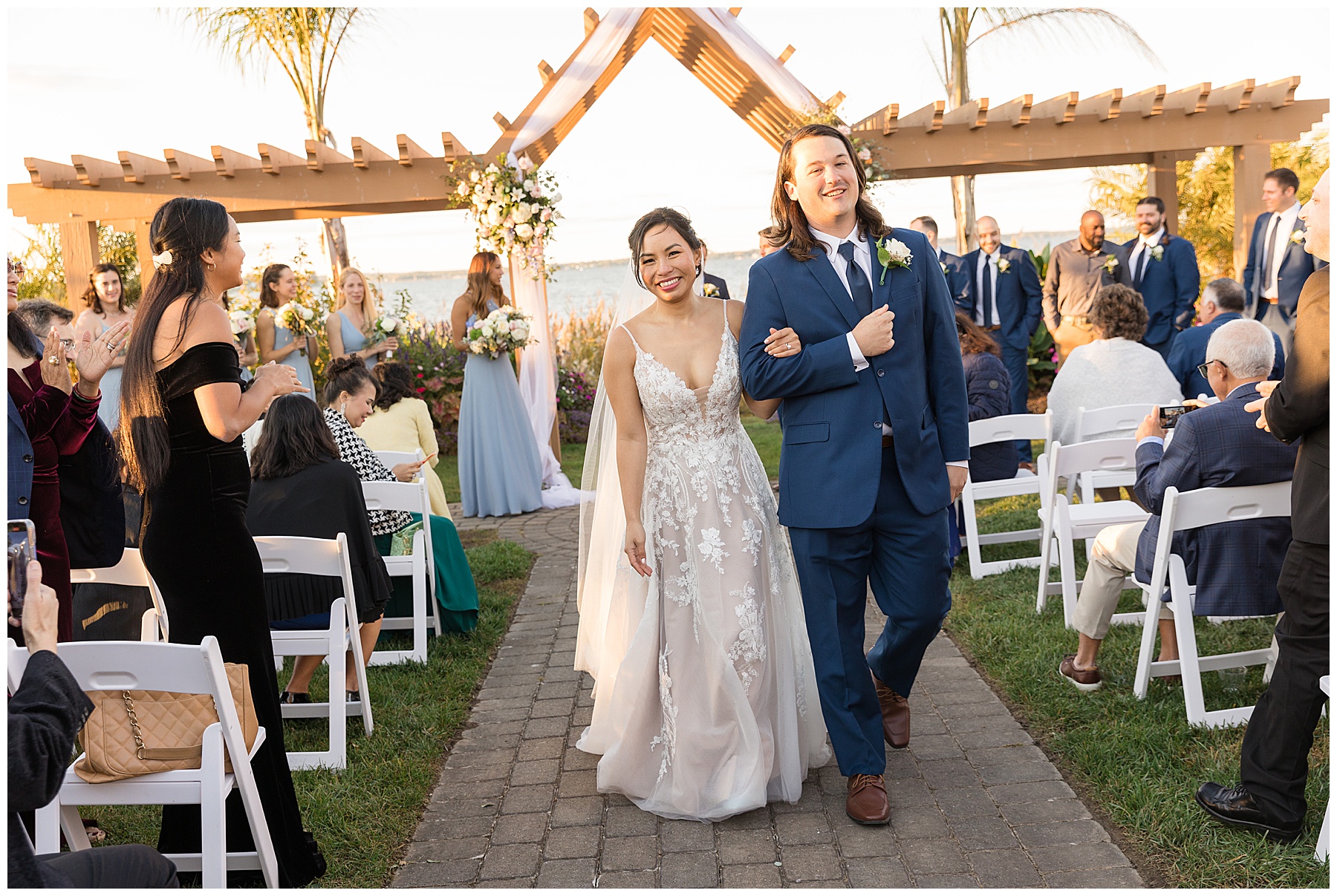 bride and groom smiling leaving ceremony