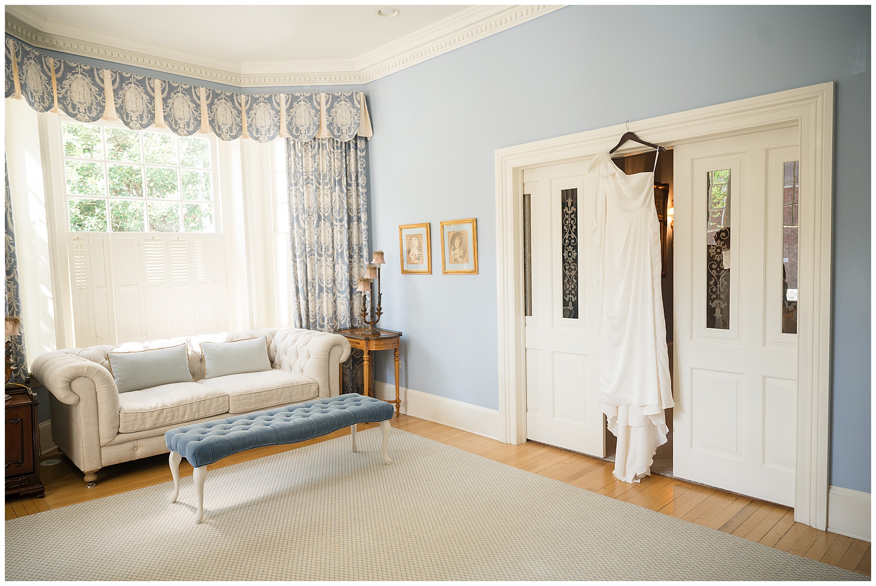 bridal dress hanging in suite