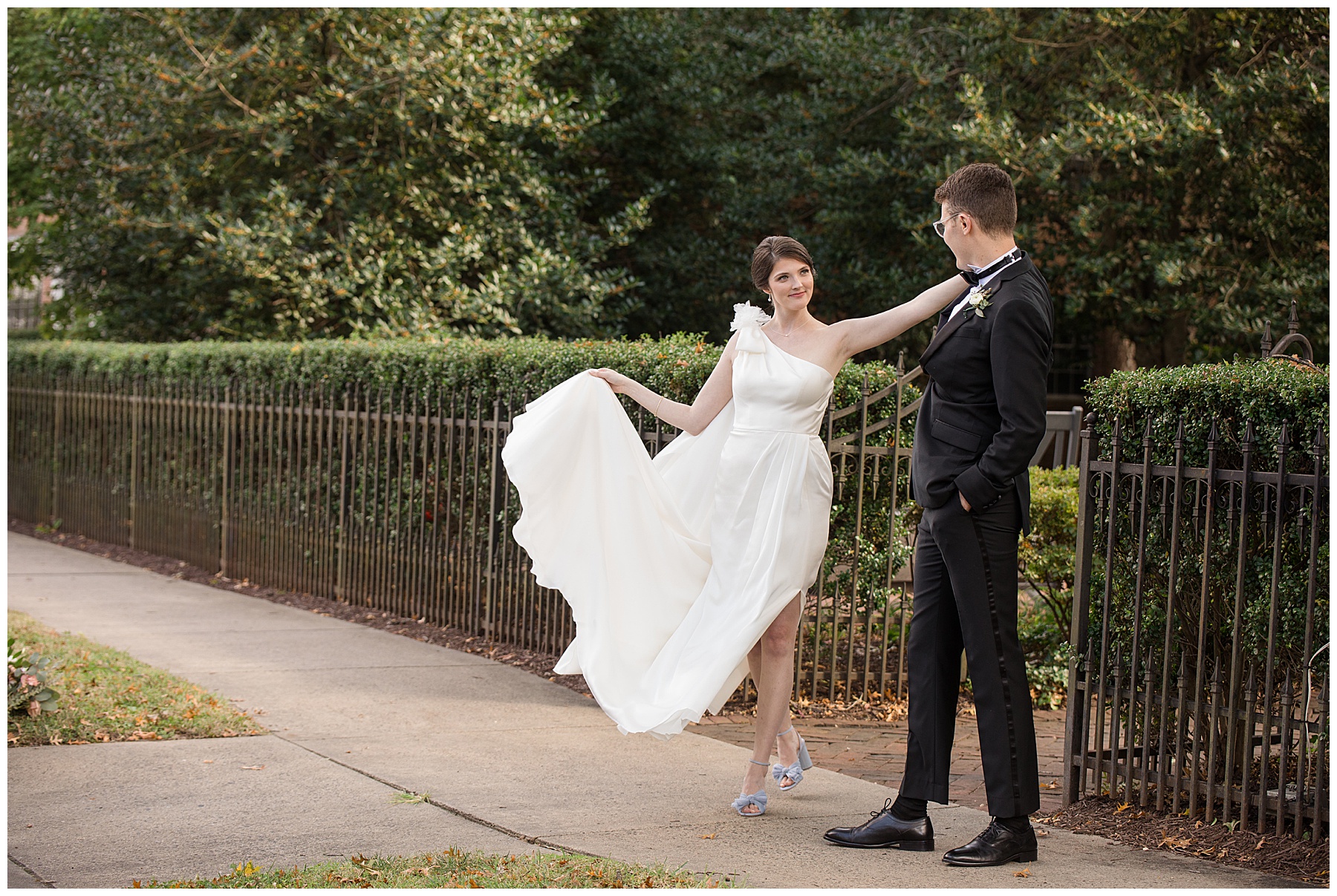 bride and groom portrait fluffing dress