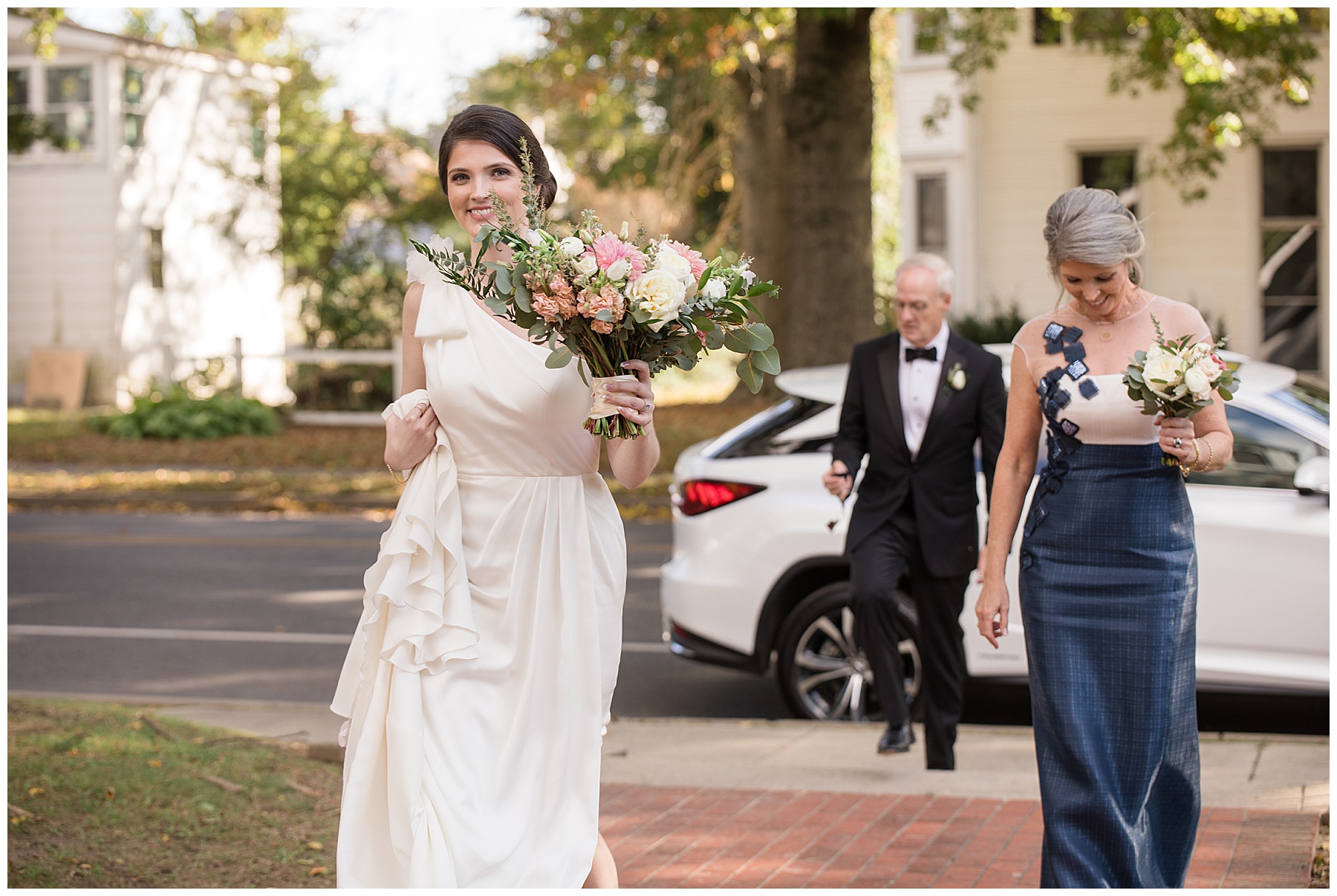 bride and parents walking to ceremony