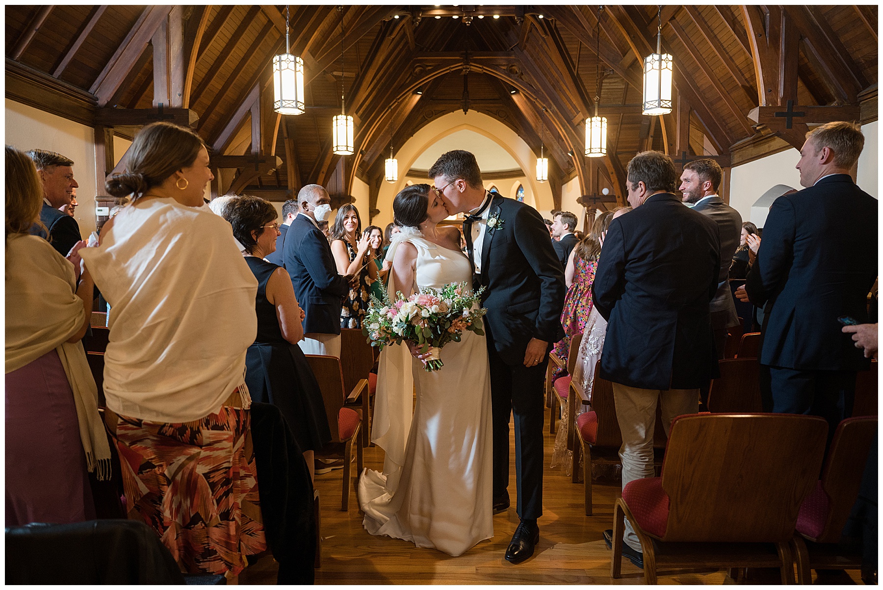 bride and groom ceremony recessional kiss