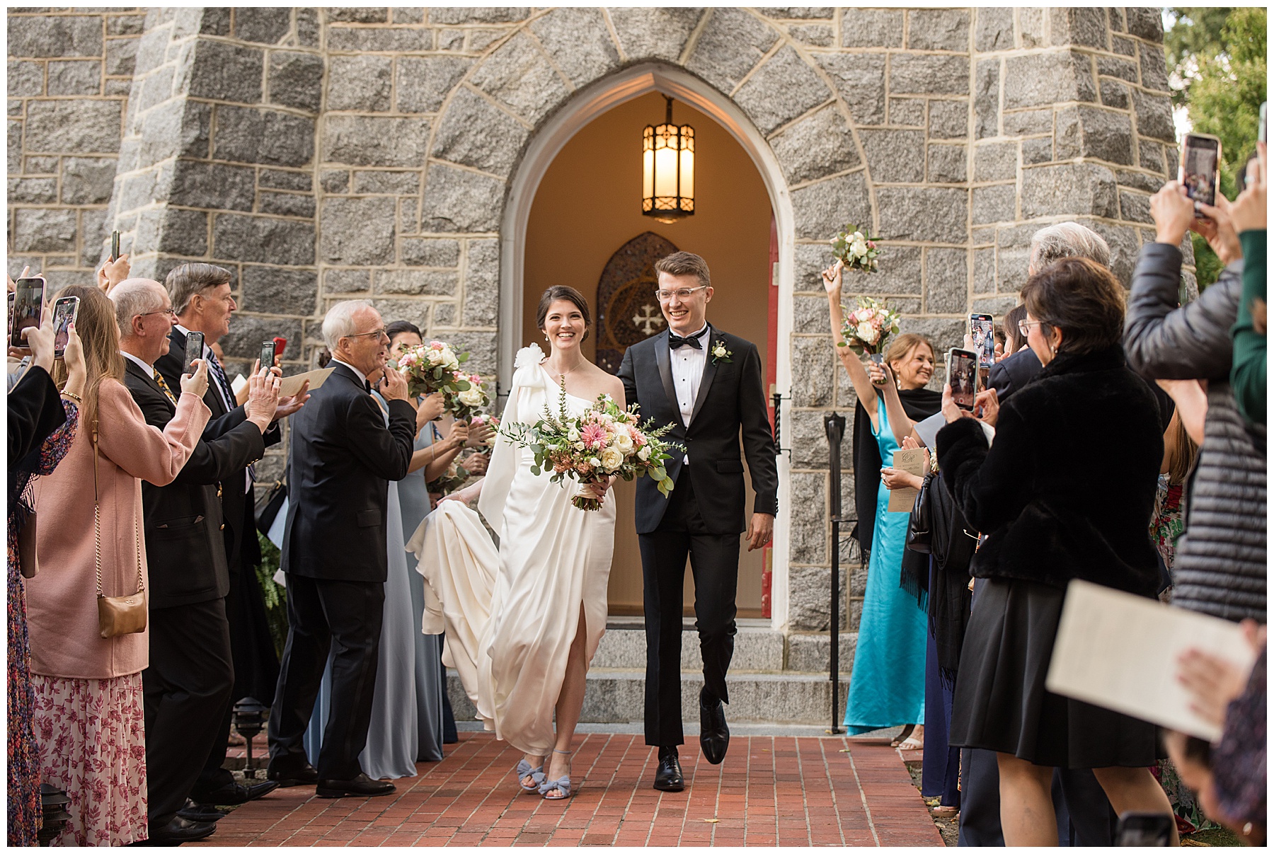 bride and groom celebrate with guests after ceremony