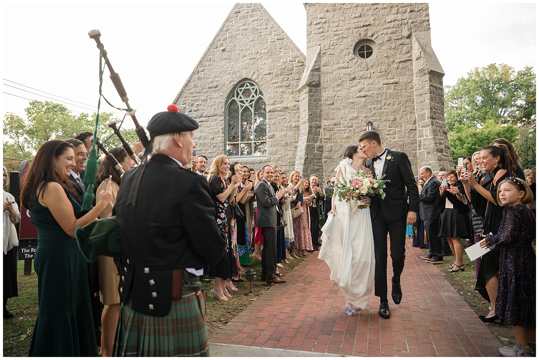 bride and groom celebrate with guests after ceremony with bagpipes