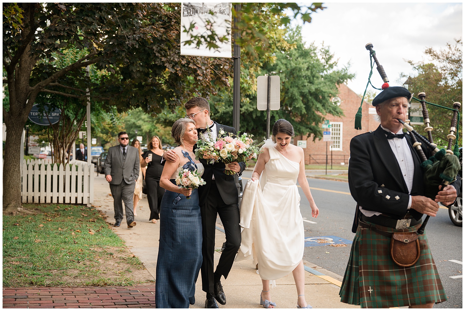 bride and groom leading guests to reception