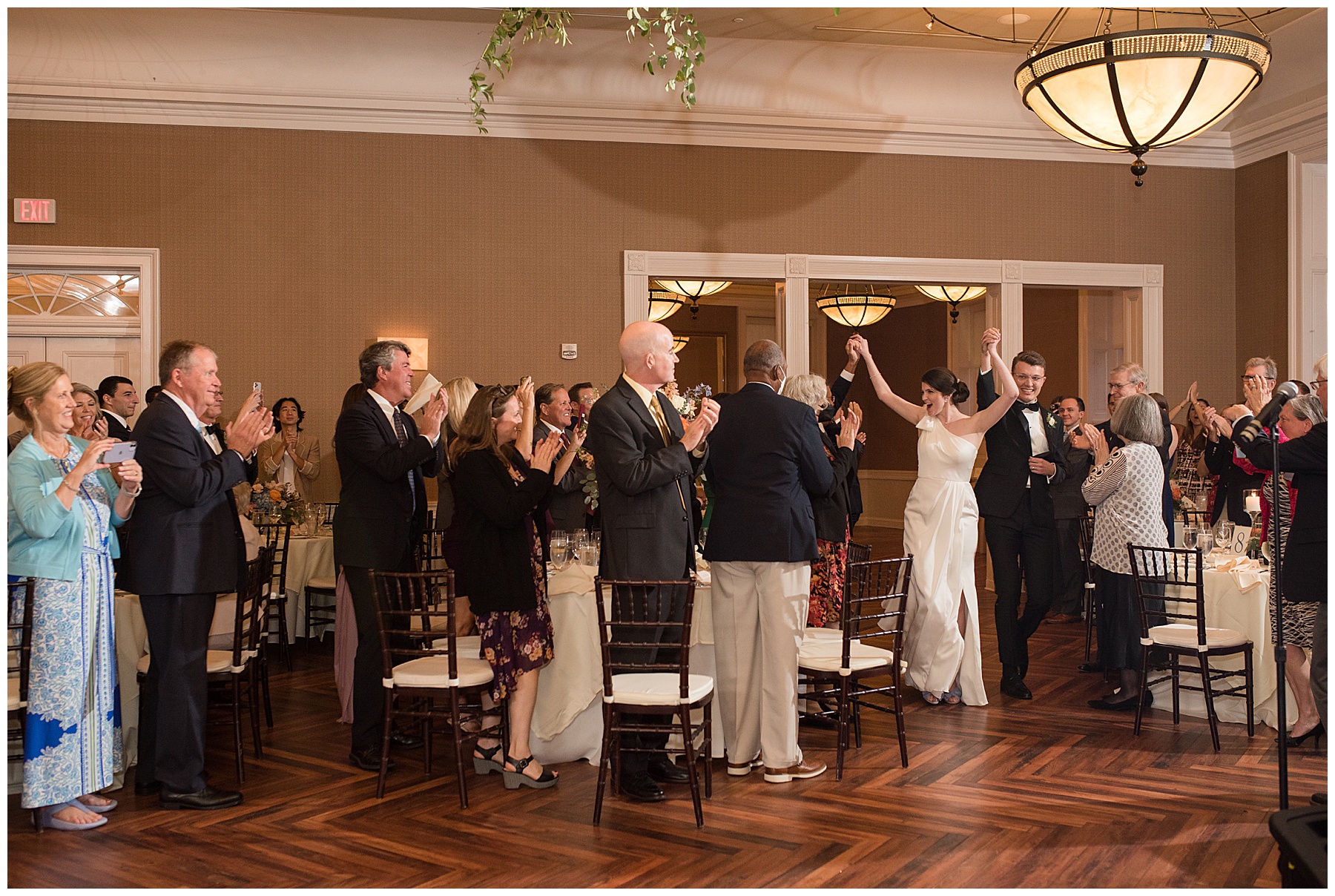 bride and groom enter wedding reception