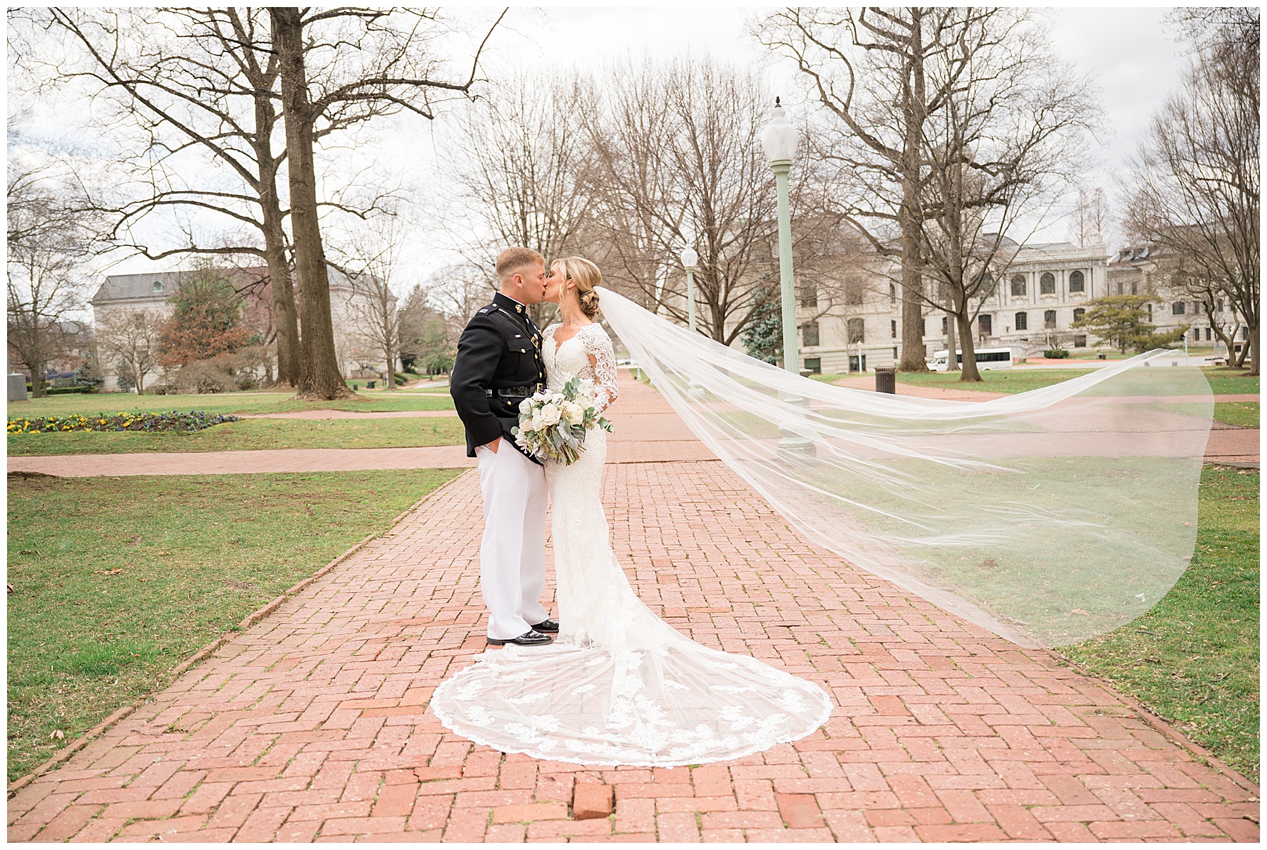 couple portrait at us naval academy veil toss