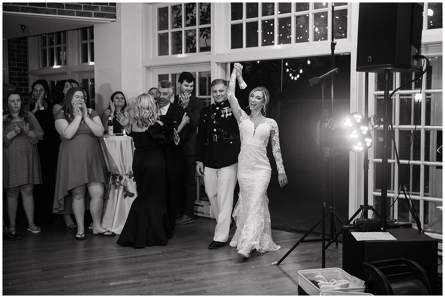 bride and groom enter wedding reception first dance