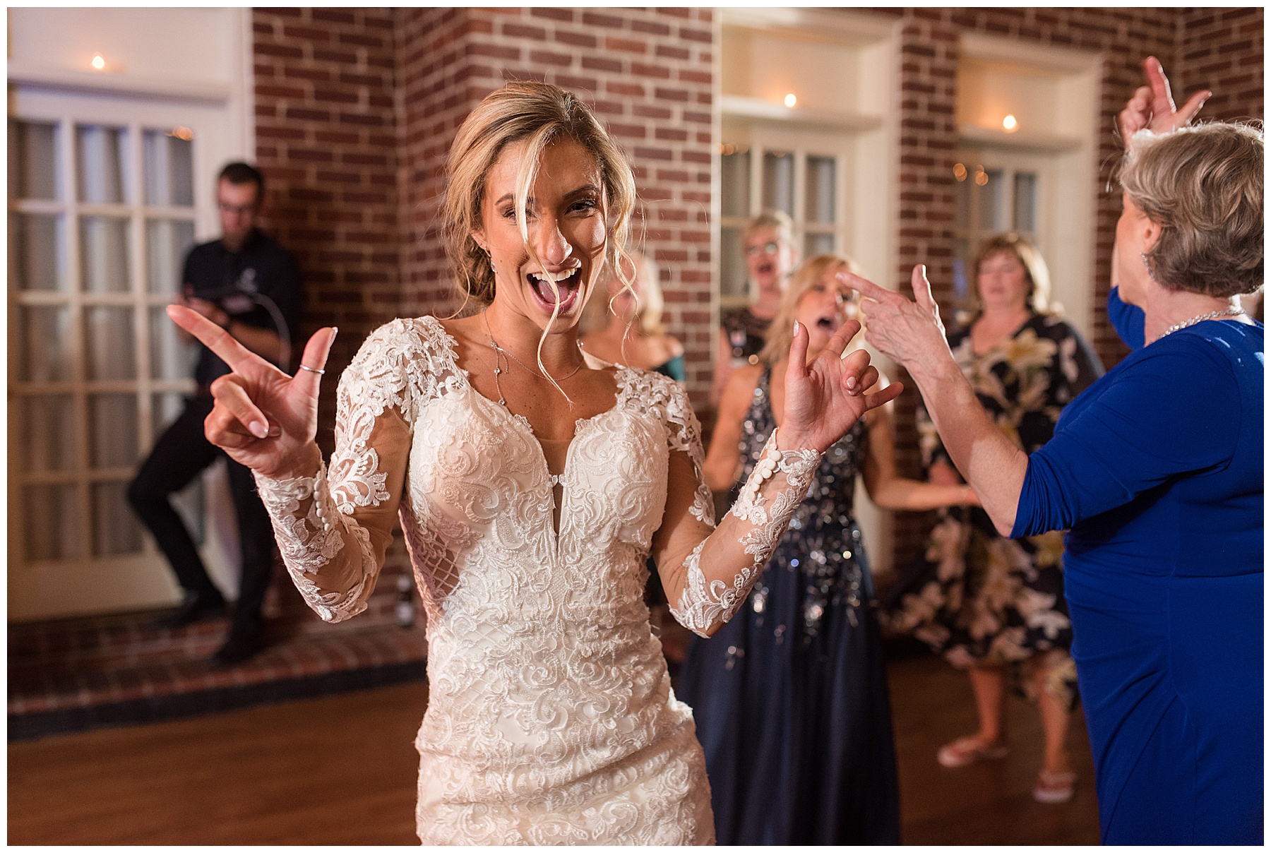 wedding reception dancing guests candid