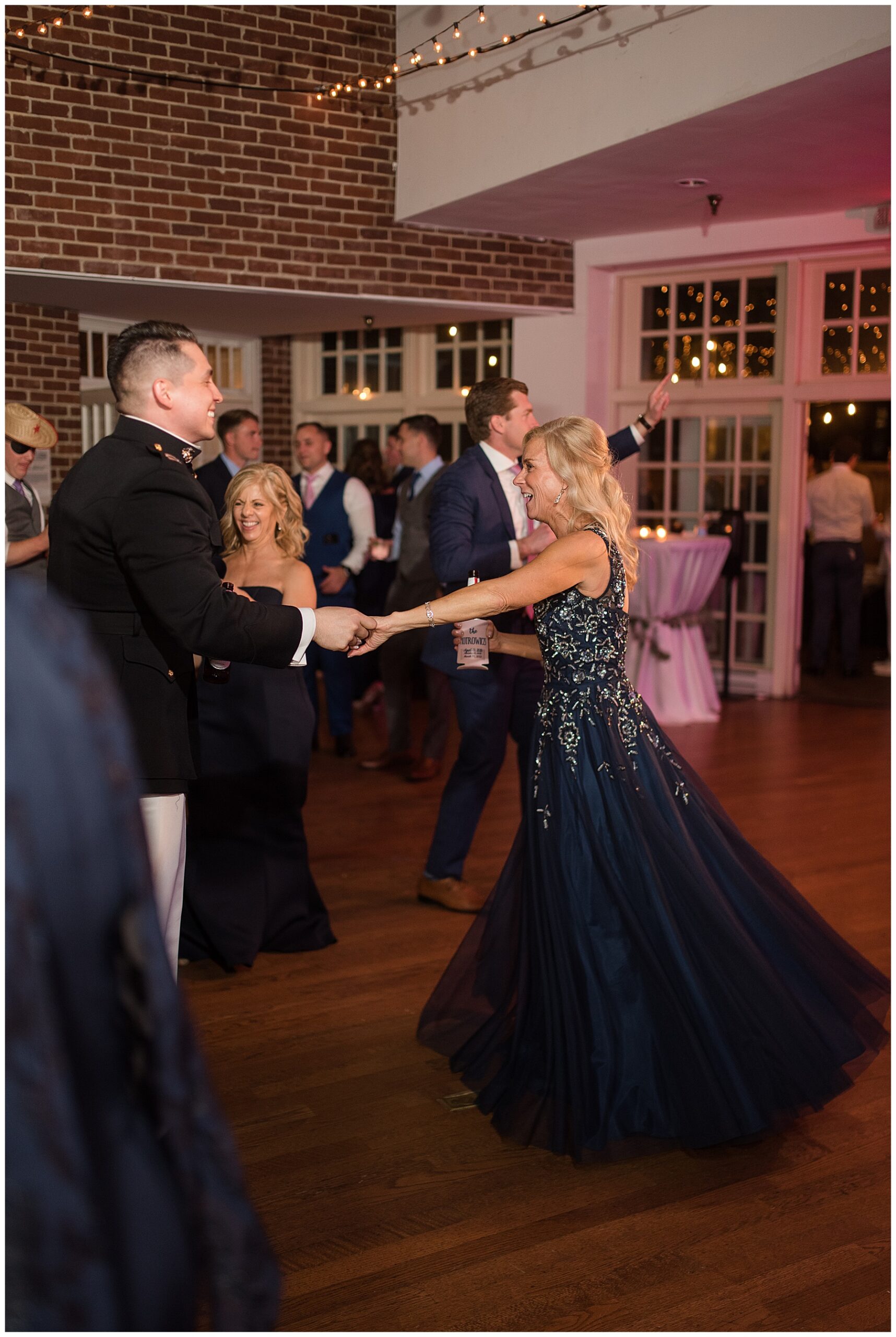 wedding reception dancing guests candid