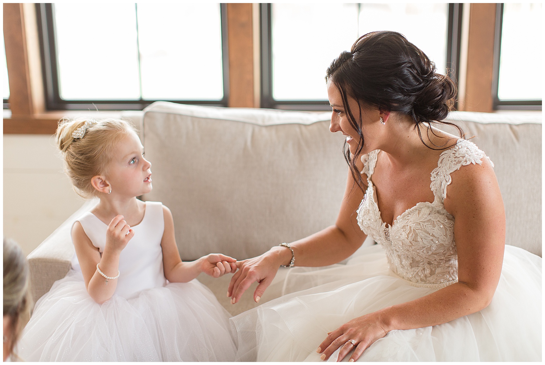 bride getting ready with flower girl