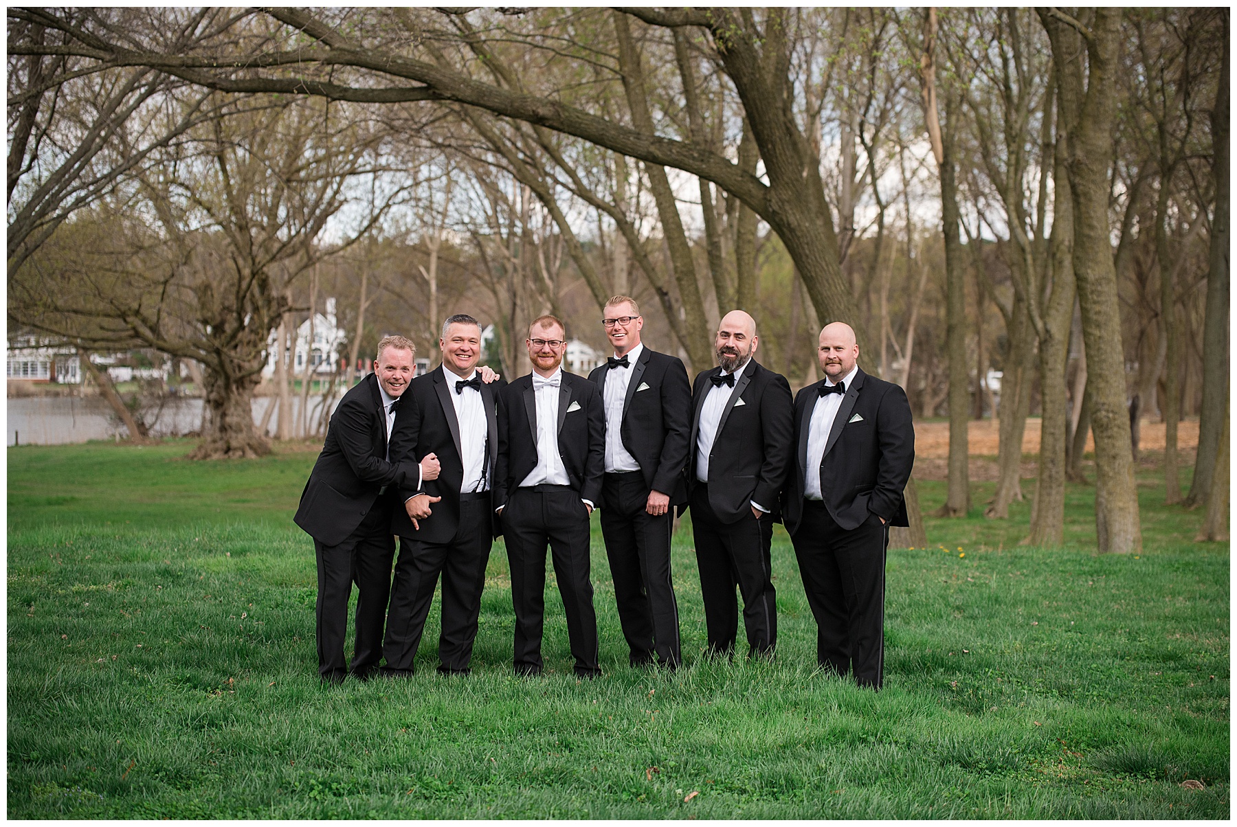 groom posing with groomsmen